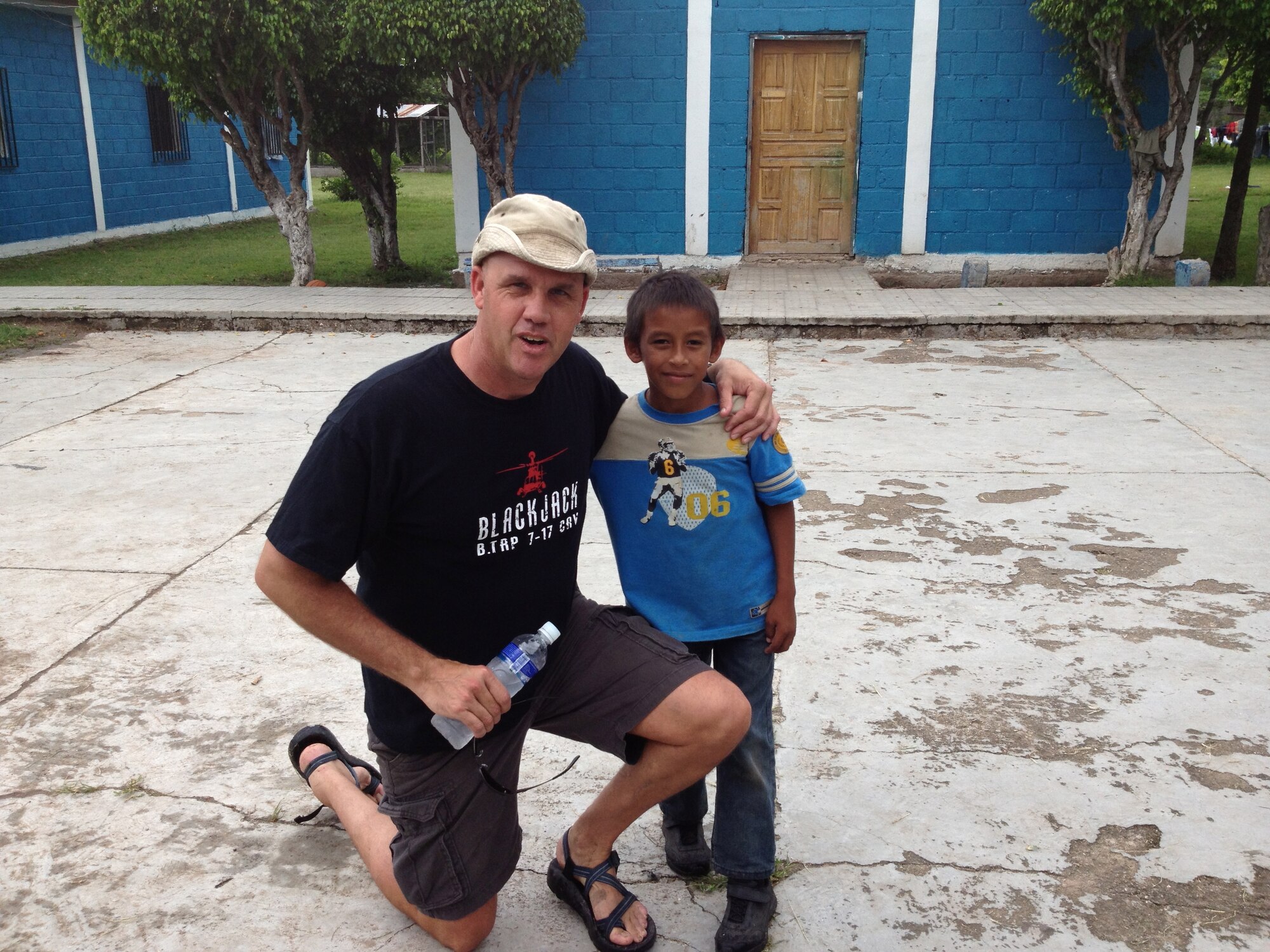 U.S. Army 1st Sgt. Robert Meek, 1-228th Aviation Regiment 1st Sgt, poses with an orphan while he and others visited San Antonio Padua Boy’s home in La Paz, Honduras, Sept. 21, 2013. Members of 1-228th make regular visits to the boys’ home to provide mentorship and food with the children.(Courtesy photo from members of 1-228th Aviation Regiment)