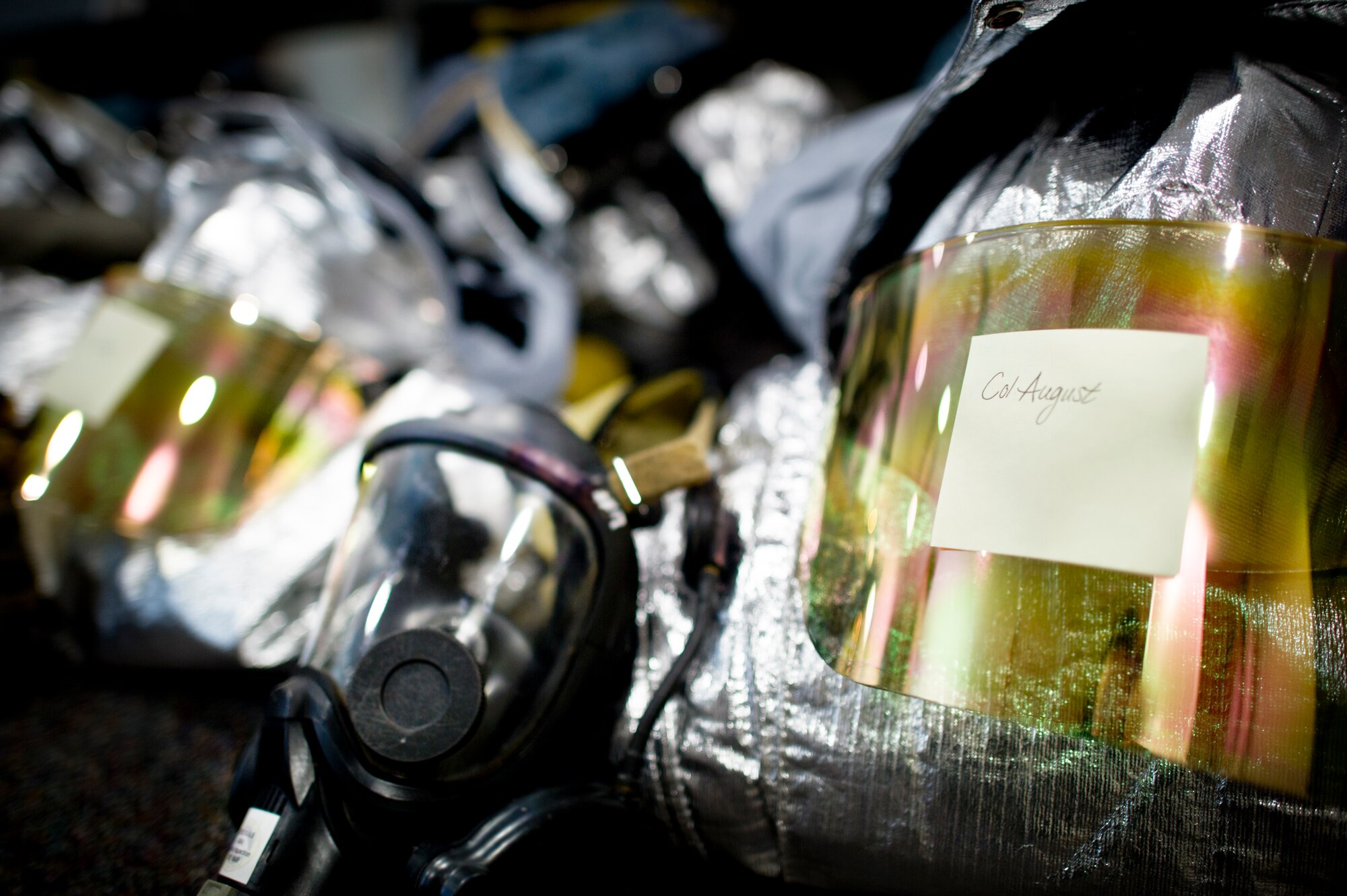 Bunker gear sits ready for wear by Col. Mark August, 374th Airlift Wing commander, during live-fire training Sept. 26, 2013 at Yokota Air Base, Japan. Wing leadership, including Col. Clarence Lukes, 374th AW vice commander, Col. Edward Brown, 374th Mission Support Group commander, Chief Master Sgt. Manuel Roblesreynoso, 374th AW command chief, and Chief Master Sgt. Joey Abelon, 374th Communication Squadron, all took part in the training. (U.S. Air Force photo by Staff Sgt Stacy Moless/released)