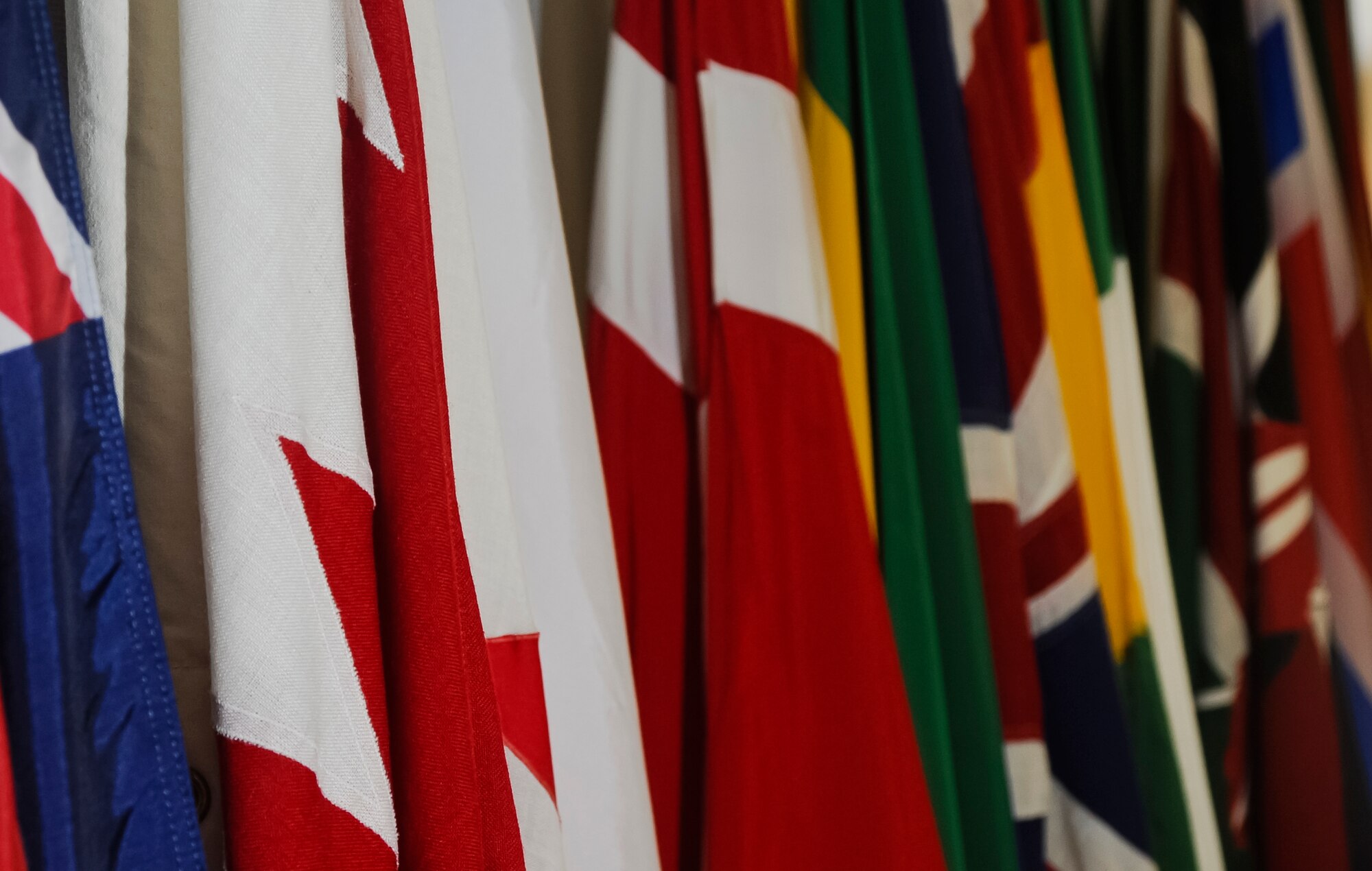 ALTUS AIR FORCE BASE, Okla. – A display of flags from countries around the world stand in the 97th Training Squadron building. The flags are displayed to symbolize all of the countries that Altus AFB has provided training for. Altus AFB provides training for more than 100 international students annually from 16 different countries to include the United Kingdom, Canada, Australia and many others. (U.S. Air Force photo by Airman 1st Class Levin Boland/Released)