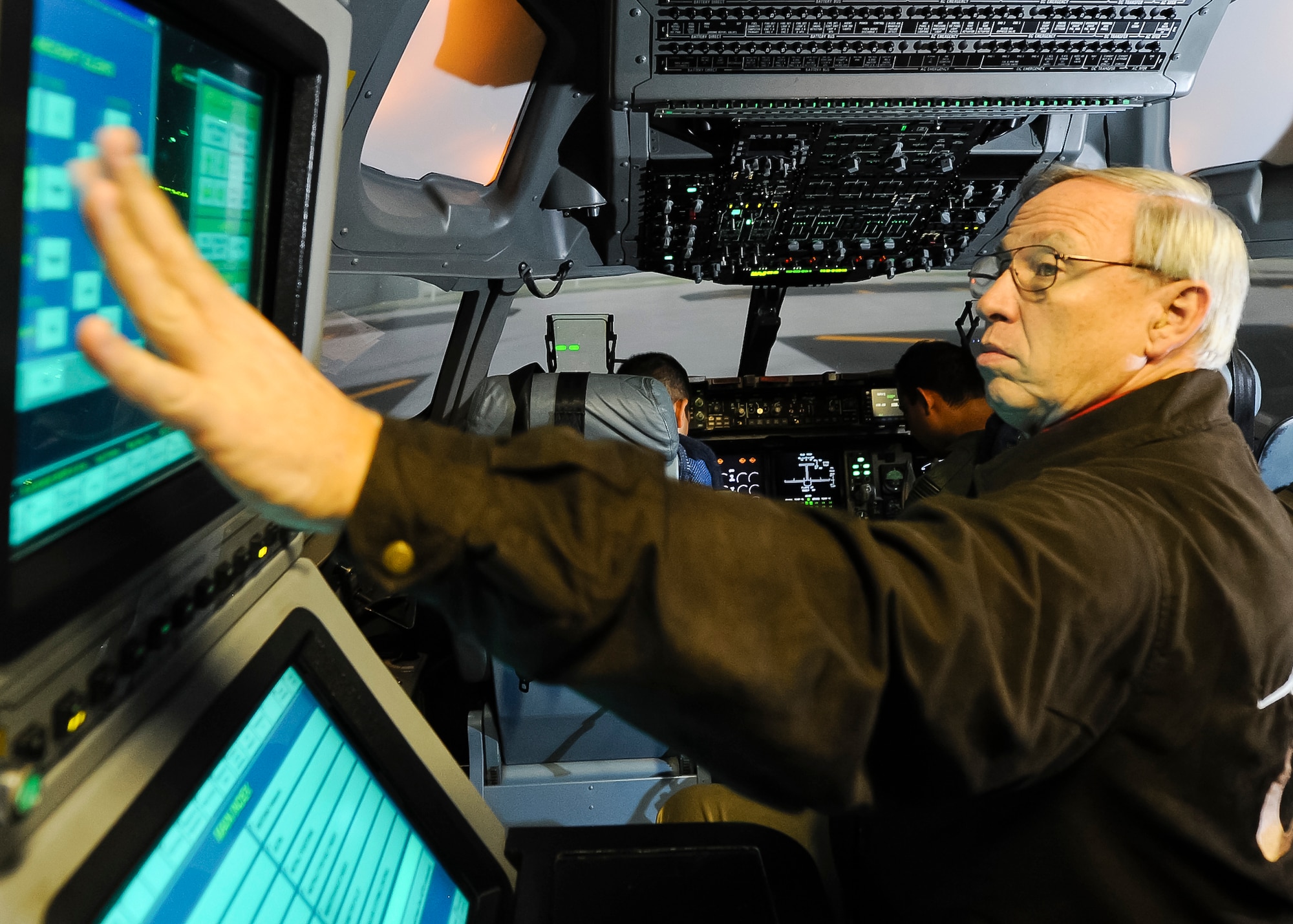 ALTUS AIR FORCE BASE, Okla. – Retired U.S. Air Force Maj. Cary Davidson, L-3 Communications C-17 Globemaster III simulator instructor, reviews international student pilot actions inside a C-17 simulator, Sept. 25. Davidson first began instructing students on the C-141 Starlifter when he was assigned to the 57th Airlift Squadron here in 1988. Twenty-five years later, Davidson has retired and come back to Altus to work for L-3 Communications as a C-17 simulator instructor. (U.S. Air Force photo by Airman 1st Class Levin Boland/Released)