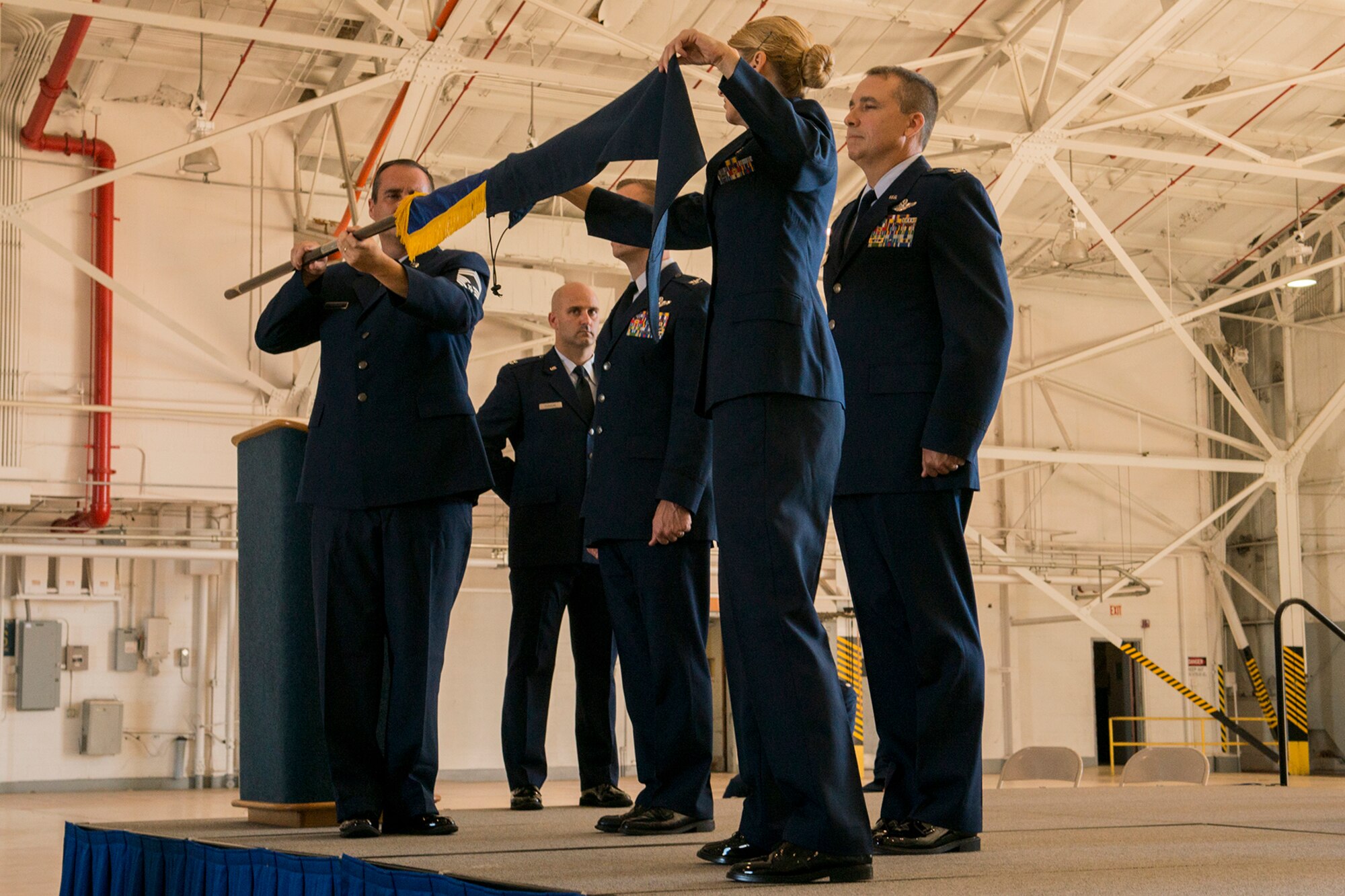 The 917th Fighter Group flag is furled and cased during an Inactivation Ceremony, Sept. 26, 2013, Barksdale Air Force Base, La. The 917th fell victim to military defense cuts and was inactivated after a 50 history at Barksdale. (U.S. Air Force photo by Master Sgt. Greg Steele/Released)