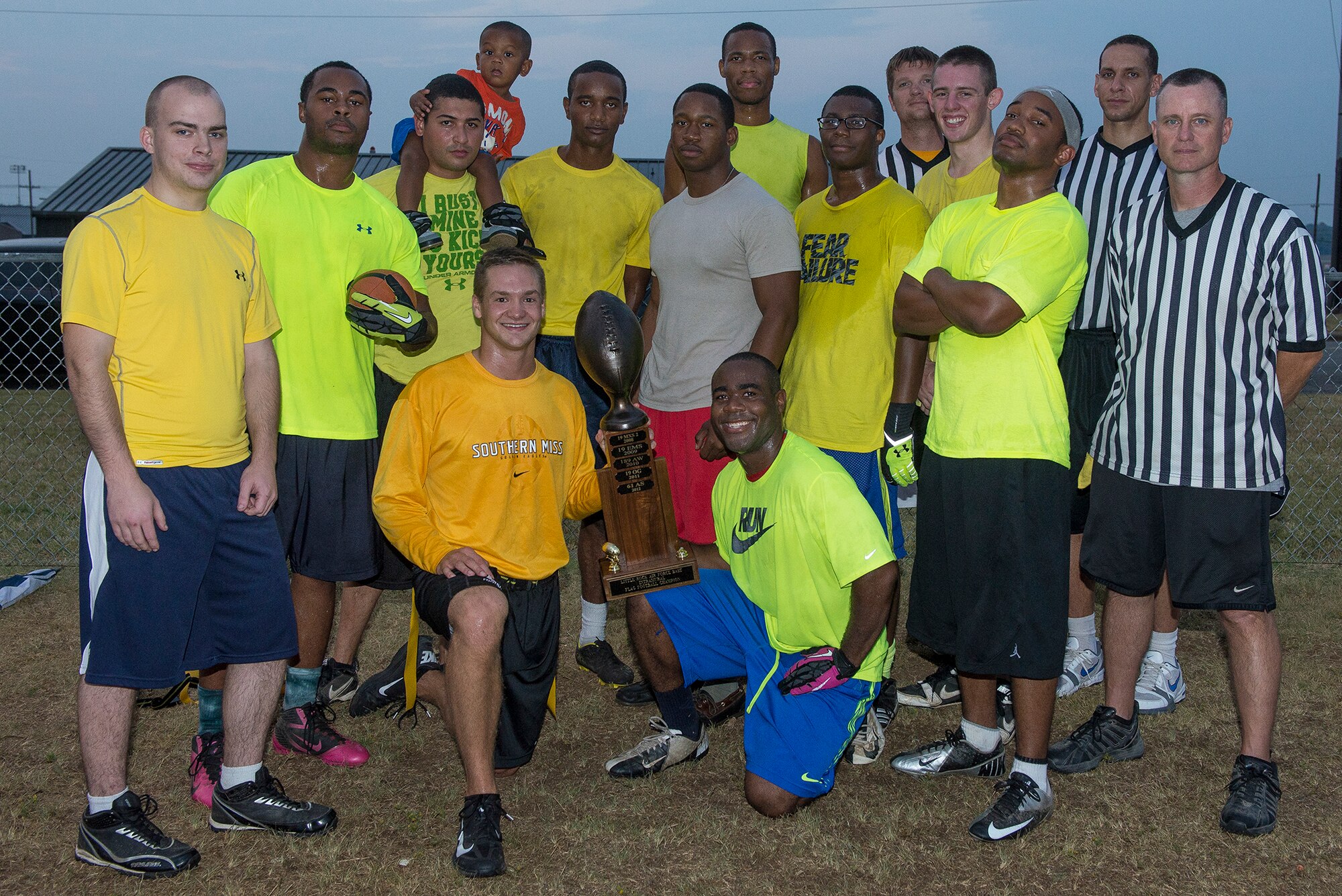 Members of the 314th Aircraft Maintenance Squadron intramural flag football team pose for a group photo after defeating the 19th Aircraft Maintenance Squadron 41-21 Sept. 18, 2013, at Little Rock Air Force Base, Ark. (U.S. Air Force photo by Staff Sgt. Russ Scalf)