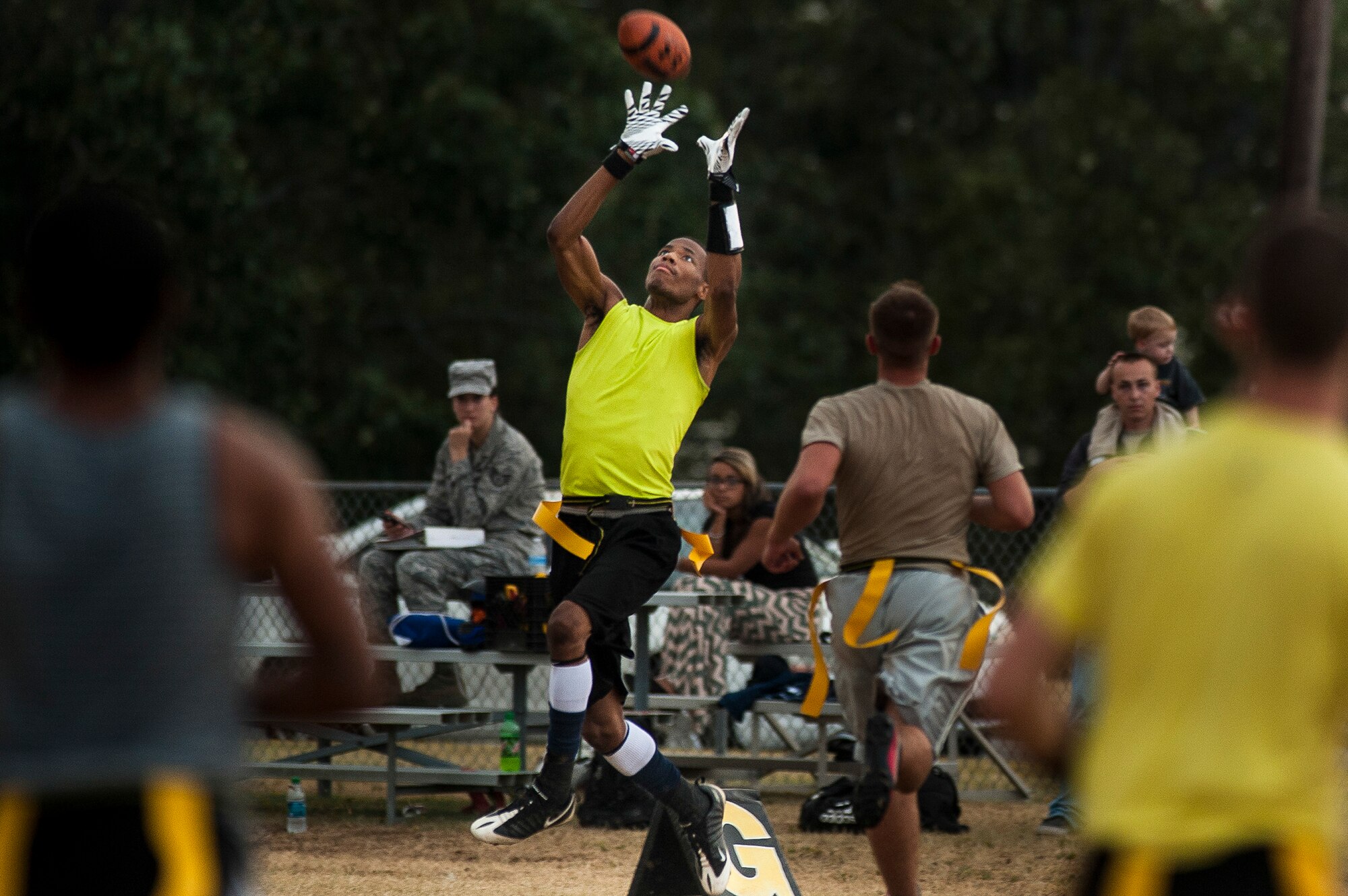 Jay Gould, a receiver for the 314th Aircraft Maintenance Squadron intramural flag football team, looks in a reception during the intramural flag football championship game Sept. 18, 2013, at Little Rock Air Force Base, Ark. Gould scored a touchdown on the play, en route to a 41-21 win. (U.S. Air Force photo by Staff Sgt. Russ Scalf)