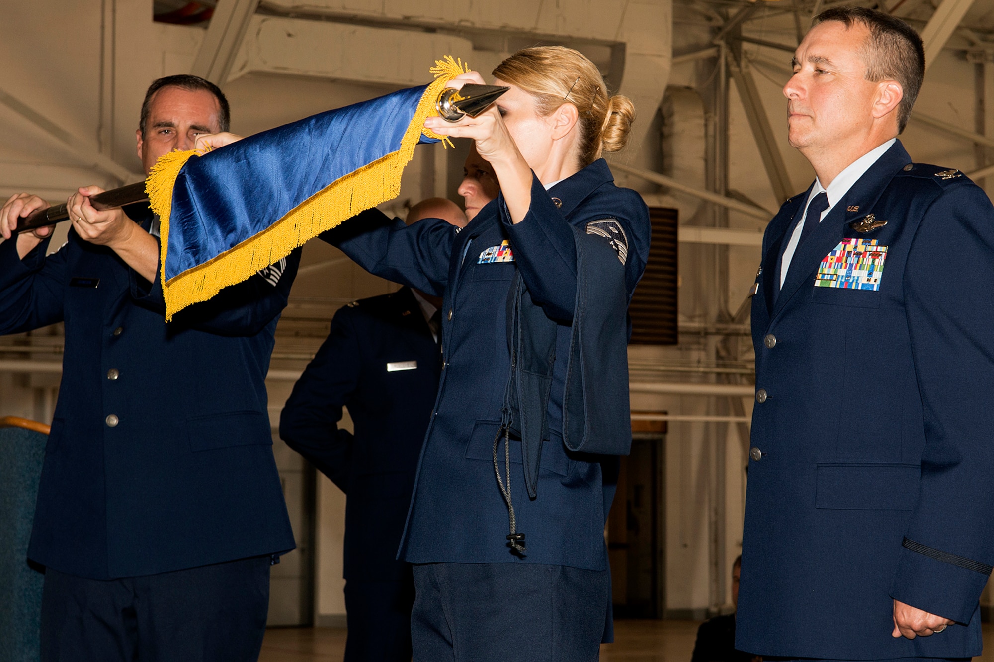 U.S. Air Force Col. John Breazeale, 917th Fighter Group (FG) commander, watches as the FG flag is furled during an Inactivation Ceremony, Sept. 26, 2013, Barksdale Air Force Base, La. The ceremony and furling of the flag officially ends the presence of the 917th at Barksdale, which began on Jan. 17, 1963, with the formation of the 917th Troop Carrier Group. (U.S. Air Force photo by Master Sgt. Greg Steele/Released)