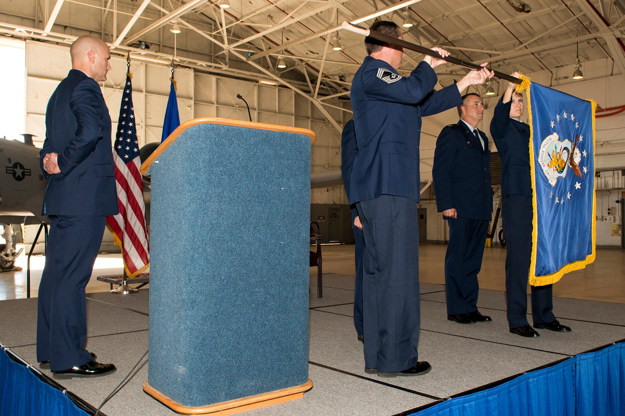 The 917th Fighter Group (FG) flag is furled during an Inactivation Ceremony, Sept. 26, 2013, Barksdale Air Force Base, La. The FG was inactivated, ending a 50 year history of the 917th at Barksdale, which started on Jan. 17, 1963, with the forming of the 917th Troop Carrier Group. (U.S. Air Force photo by Master Sgt. Greg Steele/Released)