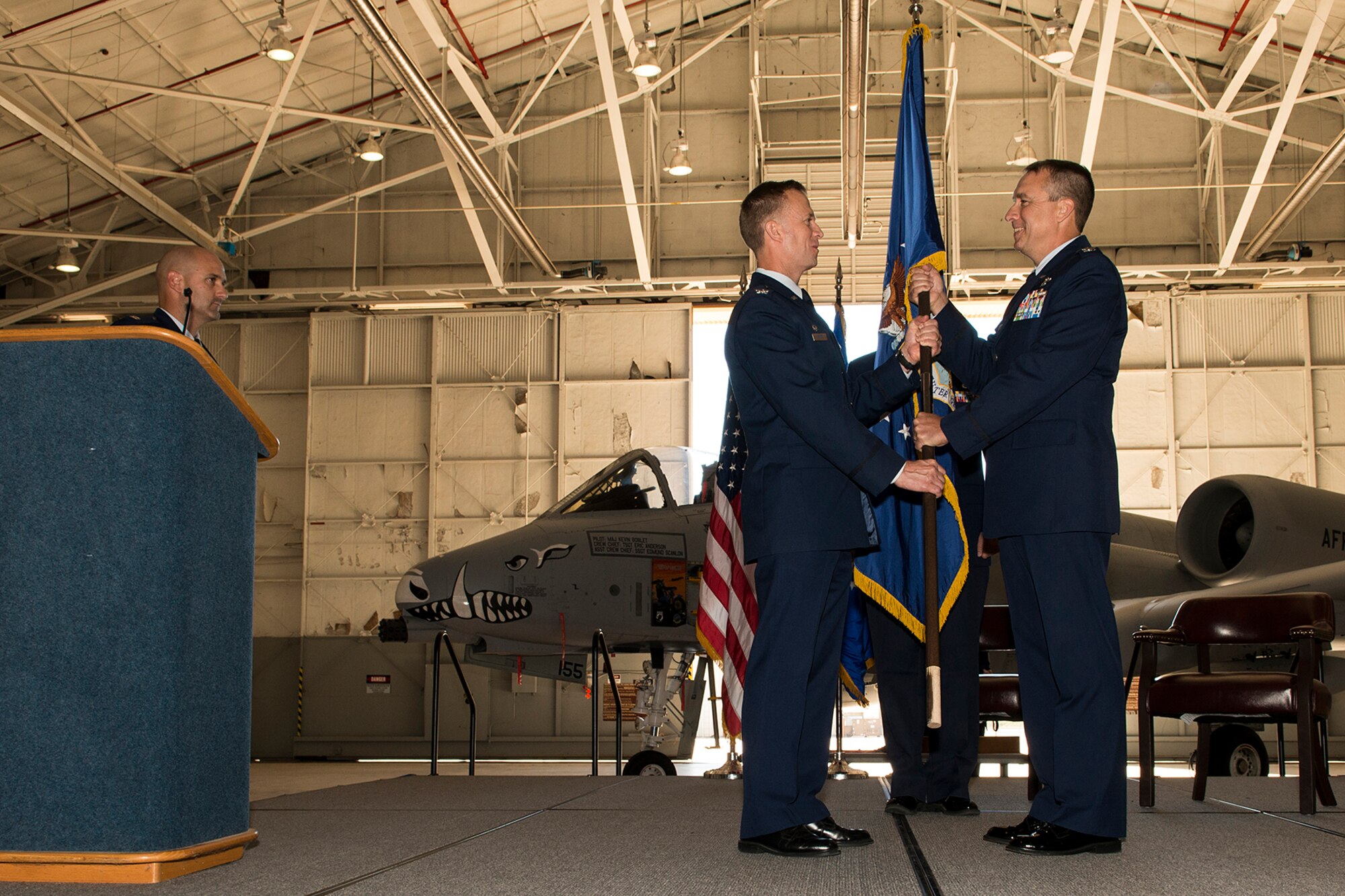 U.S. Air Force Col. John Breazeale (right), 917th Fighter Group (FG) commander, hands the FG flag to Col. Hubert Hegtvedt, 442nd Fighter Wing commander, during an Inactivation Ceremony, Sept. 26, 2013, Barksdale Air Force Base, La. The passing of the guidon officially inactivates the FG, ending a 50 year presence of the 917th at Barksdale. (U.S. Air Force photo by Master Sgt. Greg Steele/Released)