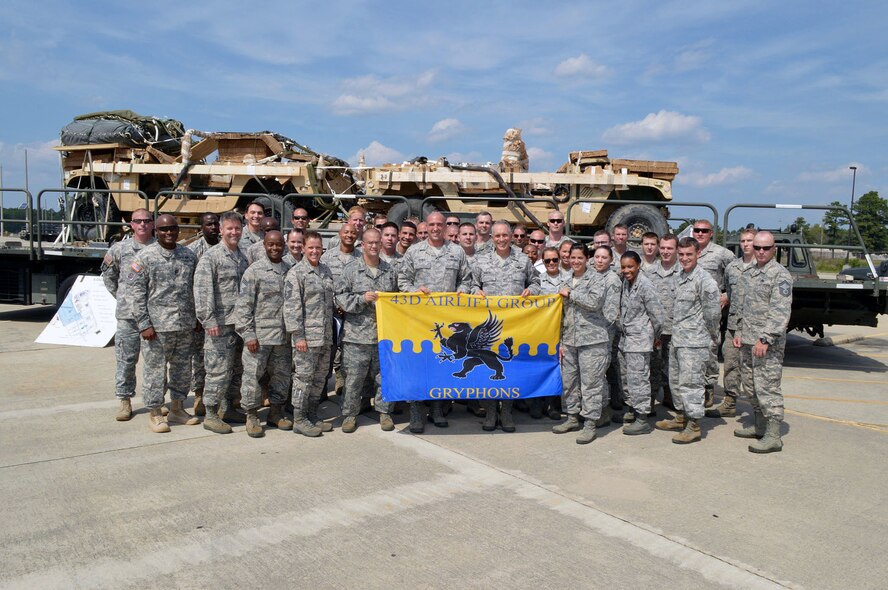 Maj. Gen. Rick Martin, U.S. Air Force Expeditionary Center commander, poses for a group photo with Col. Daniel Tulley, 43d Airlift Group commander, Chief Master Sgt. Karen Reed, 43d Airlift Group superintendent, Maj. Joseph Whittington, 3d Aerial Port Squadron commander, 18th Airborne Division Soldiers, and Airmen from the 3d Aerial Port Squadron on Sep 16.  General Martin visited Pope Army Airfield, N.C. to see first-hand how the 43d Airlift Group Airmen support the Global Response Force mission.  (U.S. Air Force Photo/Marvin Krause)