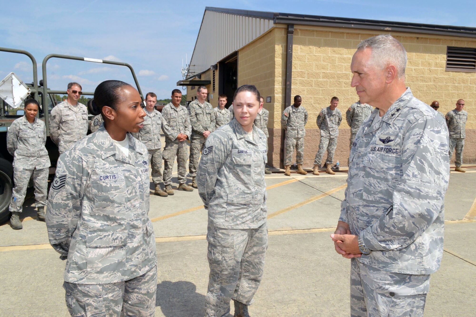 Maj. Gen. Rick Martin, U.S. Air Force Expeditionary Center commander, receives a mission briefing from Tech. Sgt. Shaffiyah Curtis, 3d Aerial Port Squadron, during his tour of 43d Airlift Group units Sep 16.  General Martin visited Pope Army Airfield, N.C. to see first-hand how the 43d Airlift Group Airmen support the Global Response Force mission.  (U.S. Air Force Photo/Marvin Krause)