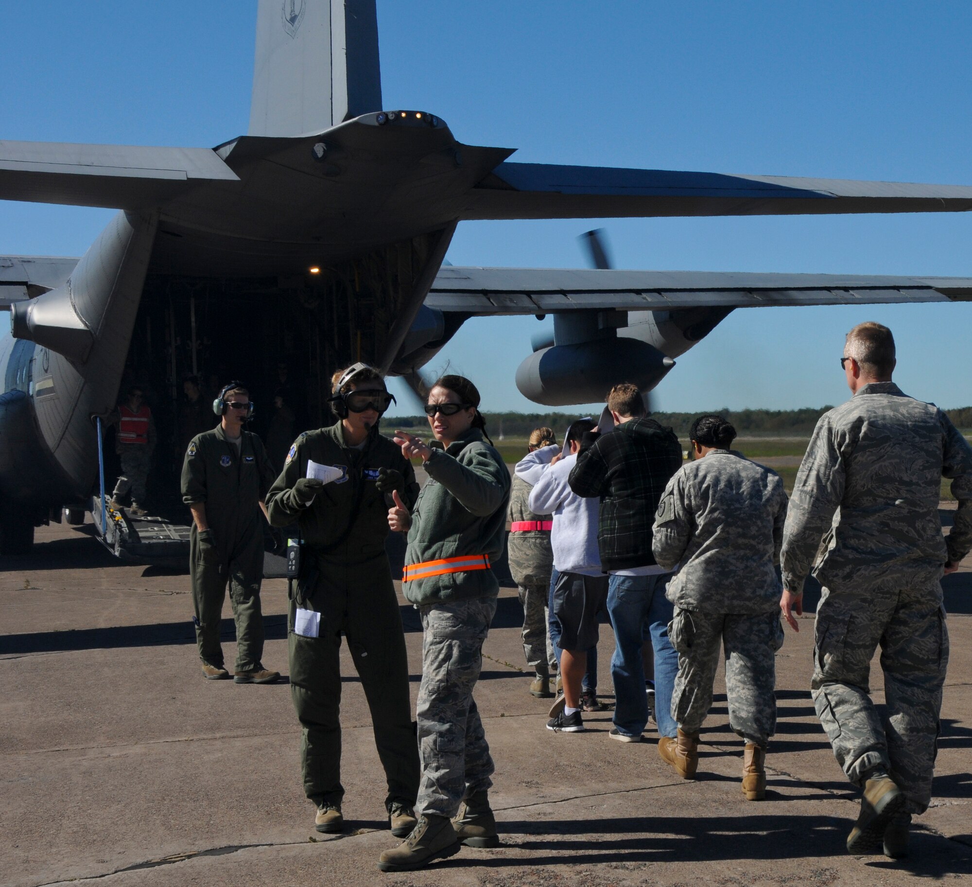 Airmen from the 133rd Airlift Wing, safely lead patients to the C-130 as part of an Aeromedical Evacuation Flight from Duluth, Minnesota to the Twin Cities. The exercise simulated a terrorist incident in Duluth that resulted in civilian evacuations to the Twin Cities and Camp Ripley. The training partnered with 14 civilian agencies and utilized many of the 133AW capabilities to help both Airmen and civilians react better when facing disasters. (U.S. Air National Guard photo by Senior Airman Kari Giles.)