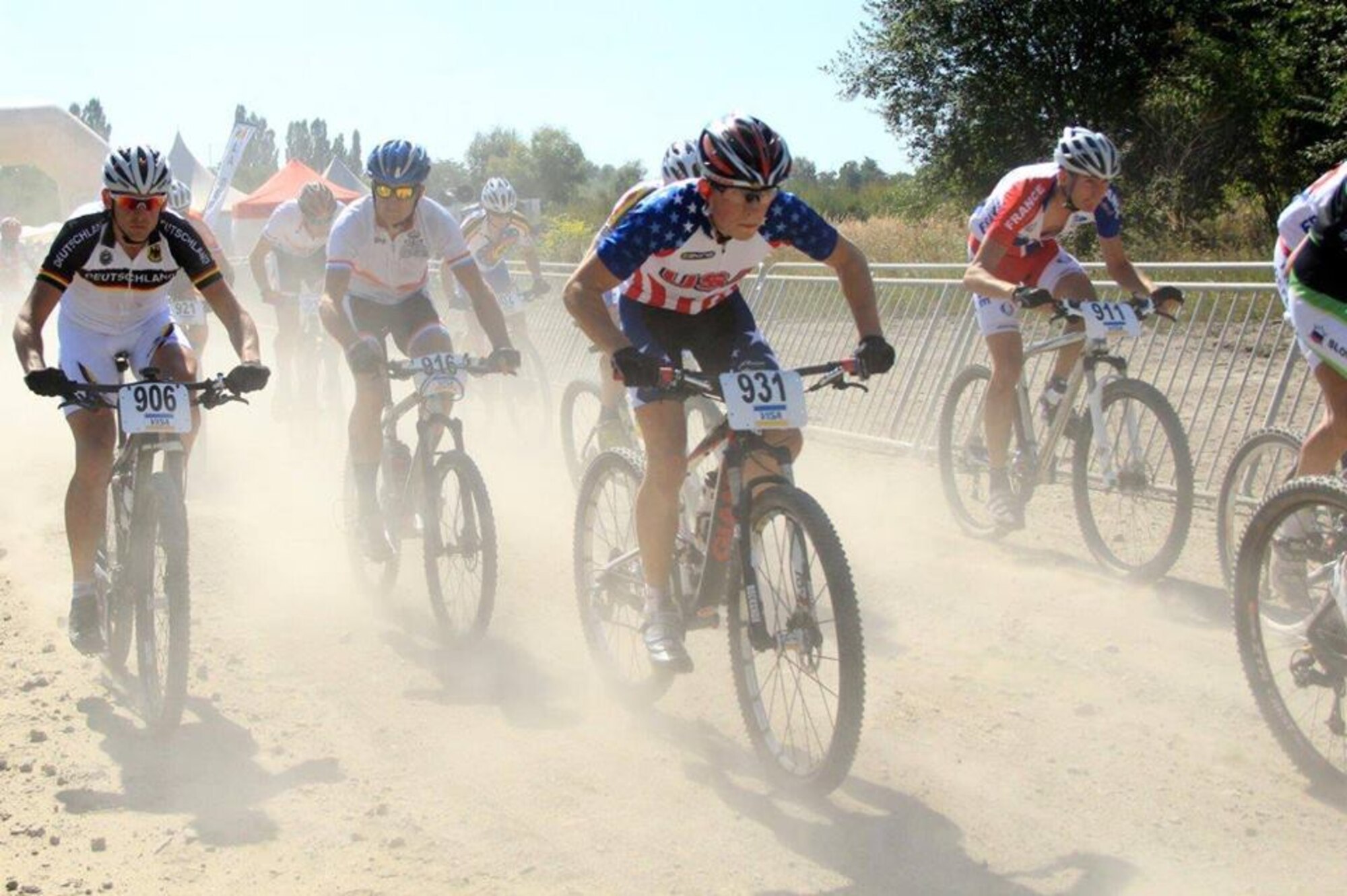 Senior Airman David Flaten showcases his professional biking skills during the 2013 Conseil International Sport Militaire (CISM) cycling competition. The 811th Security Forces Squadron protective service member was selected to represent the United States Armed Forces for the cycling championship event held Sept. 2 to Sept. 6, in Leopoldsburg, Belgium. (Courtesy photo)