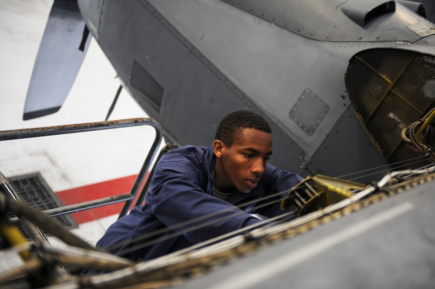 U.S. Air Force Airman 1st Class Earl White, 23d Component Maintenance Squadron aircraft fuels system apprentice, fixes wiring on an HC-130P Combat King at Moody Air Force Base, Ga., Sept. 26, 2013. The 23d CMS aircraft fuel systems repair section removes, repairs and installs fuel systems and malfunctioning components on various aircraft. (U.S. Air Force photo by Airman 1st Class Olivia Bumpers/Released)