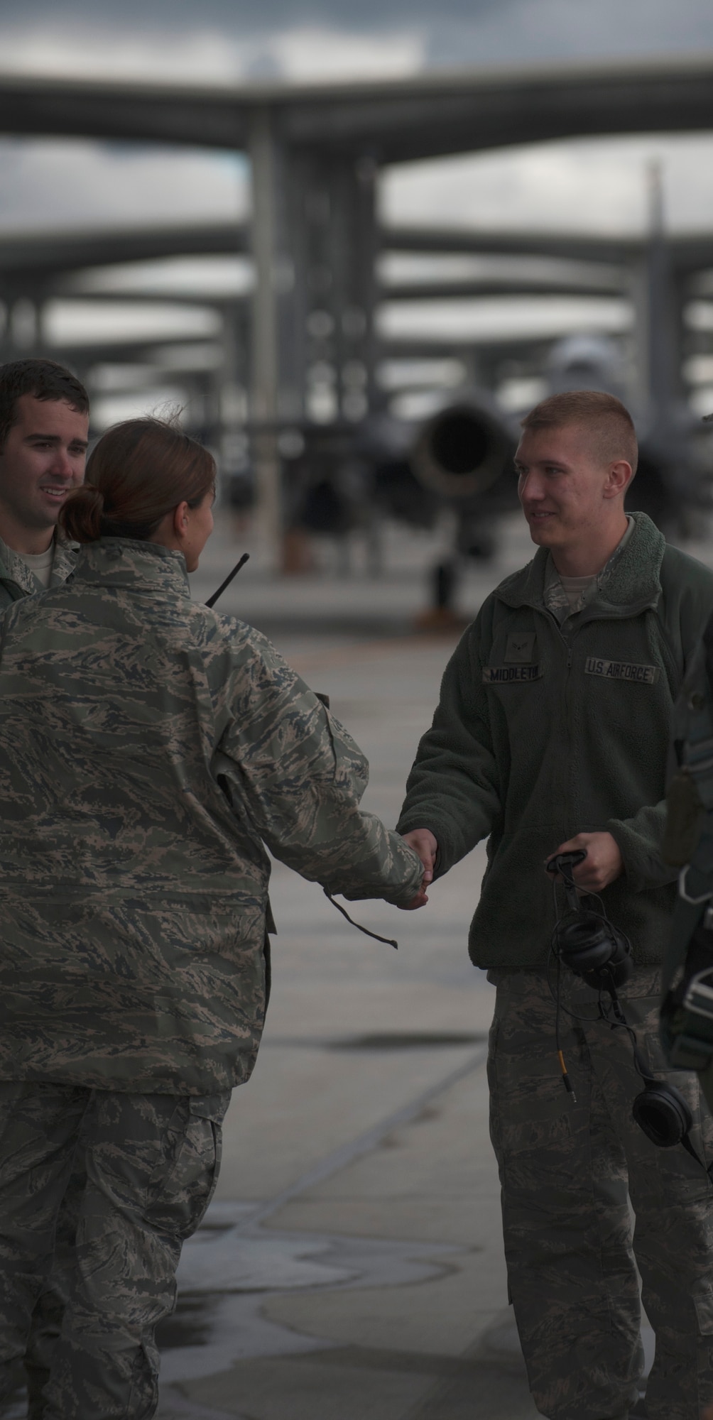 U.S. Air Force Capt. Angelina Stephens, 366th Aircraft Maintenance Squadron officer-in-charge of the 391st Aircraft Maintenance Unit, shakes hands with Airman 1st Class Chase Middleton, 366th AMXS crew chief, Sept. 25, 2013, at Mountain Home Air Force Base, Idaho. Stephens recently received the Air Combat Command Lance P. Sijan Leadership Award. (U.S. Air Force photo by Senior Airman Benjamin Sutton/Released)