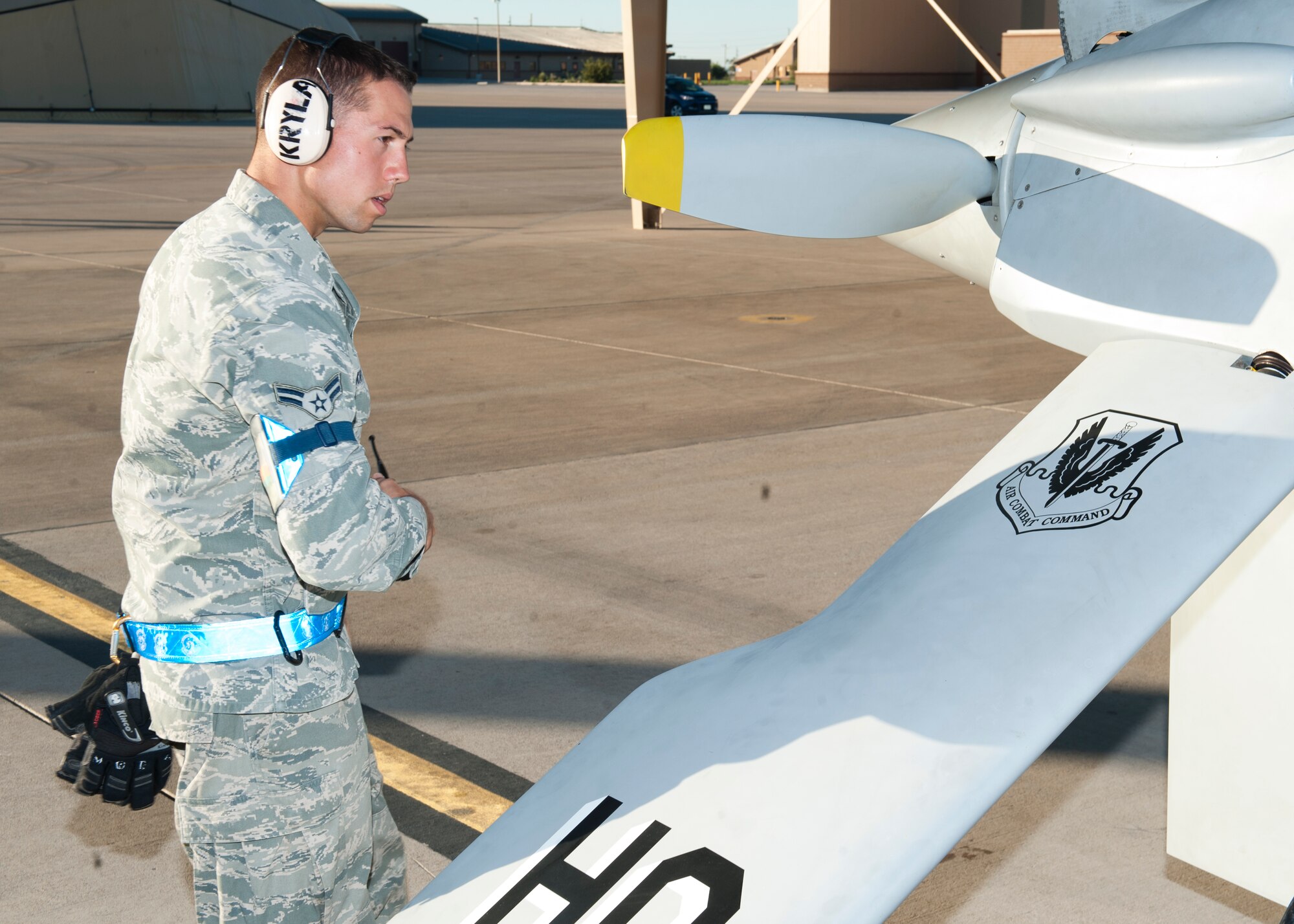 Airman 1st Class Justin Kryla, 849th Aircraft Maintenance Squadron crew chief, performs functionality checks on an MQ-1 Predator at Holloman Air Force Base, N.M., Sept. 25. The Predator’s primary functions are to fulfill reconnaissance and forward observation roles.  In addition to the pilot and sensor operator who control the aircraft from a ground control station, flying an MQ-1 requires a culmination of efforts from various squadrons. (U.S. Air Force photo by Airman 1st Class Daniel E. Liddicoet/Released)