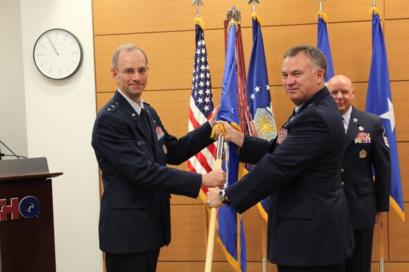 Maj. Gen. Mark A. Ediger, Deputy Air Force Surgeon General, officiates the Air Force Medical Support Agency change of command ceremony of Brig. Gen. James J. Carroll, the former commander at the Defense Health Headquarters in Falls Church, Va. on Sept. 26, 2013.  General Carroll also served as the 16th Biomedical Sciences Corps chief and Assistant Surgeon General for Modernization, where he oversaw daily operations of the Modernization Directorate for requirements, aerospace medicine and information management and technology for the AFMS.  Brig. Gen. James E. McClain has taken command of AFMSA and other duties during the ceremony.  (U.S. Air Force photo / Jon Stock)