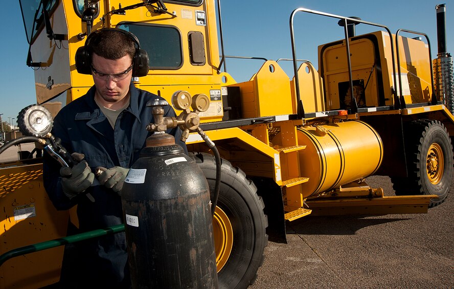 Senior Airman Daniel Fast, 22nd Logistics Readiness Squadron vehicle maintenance journeyman, adjusts a nitrogen pressure tank Sept. 26, 2013, at McConnell Air Force Base, Kan.  The gas pressure regulator, which restricts, loads and measures air, is one of the many pieces of equipment vehicle maintenance operators use to keep McConnell AFB’s vehicle fleet efficient. (U.S. Air Force photo/Senior Airman Maurice A. Hodges)