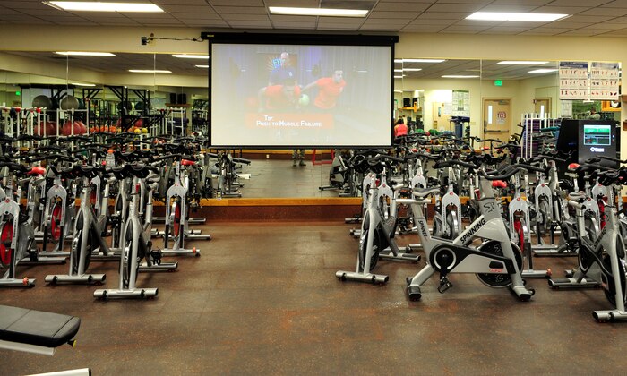 A fitness kiosk has been installed in the aerobics room at the Beale Air Force Base, Harris Fitness Center. The fitness kiosks enable fitness staff or customers to schedule one of 30 pre-loaded workout videos, which will be updated quarterly. (U.S. Air Force photo by Airman 1st Class Bobby Cummings/Released)