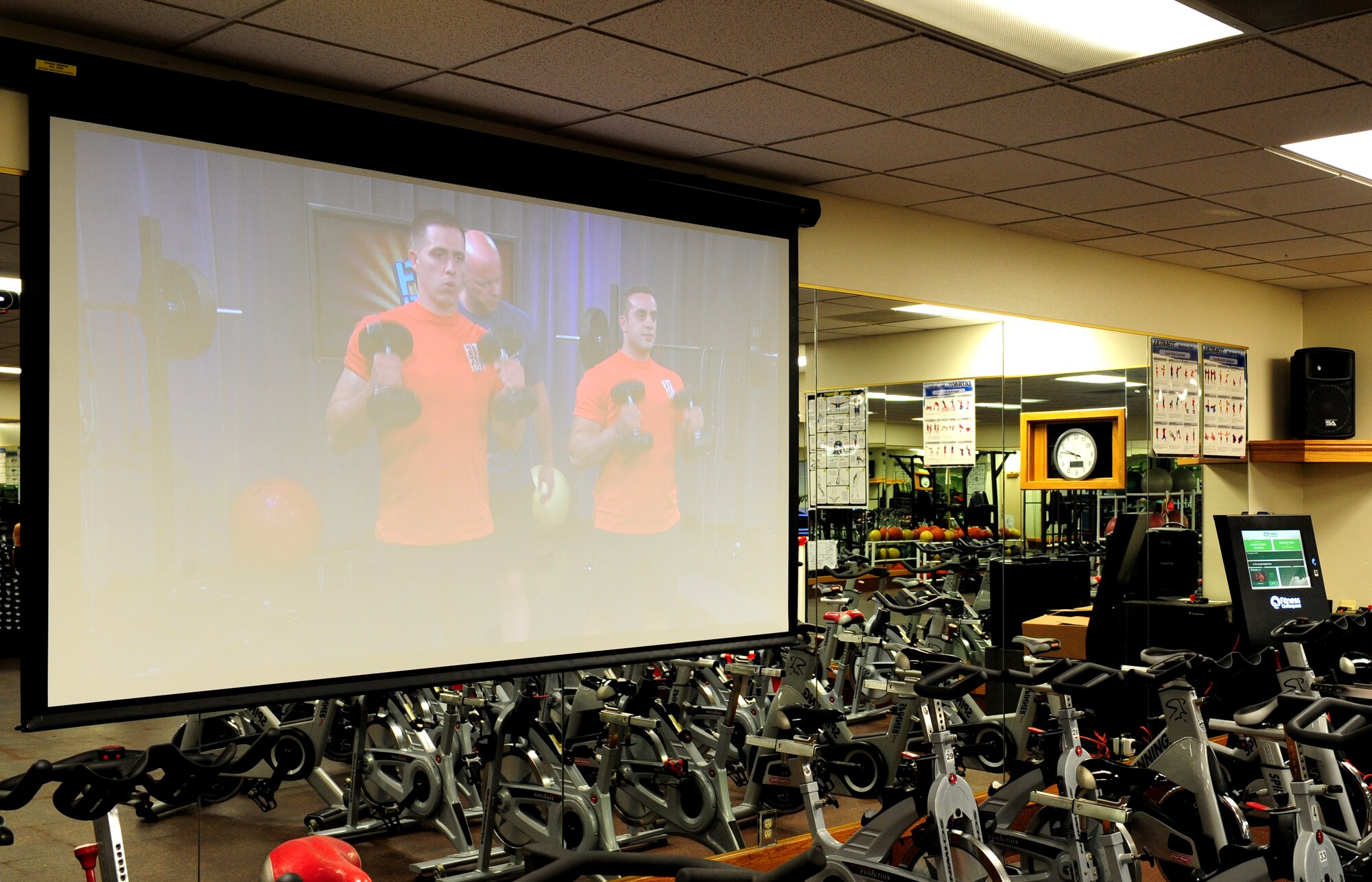 The Fit for Duty workout plays on a projector in the aerobics room at the Beale Air Force Base, Harris Fitness Center. The virtual workout is an option on the new fitness kiosk available to Airmen.  (U.S. Air Force photo by Airman 1st Class Bobby Cummings/Released)