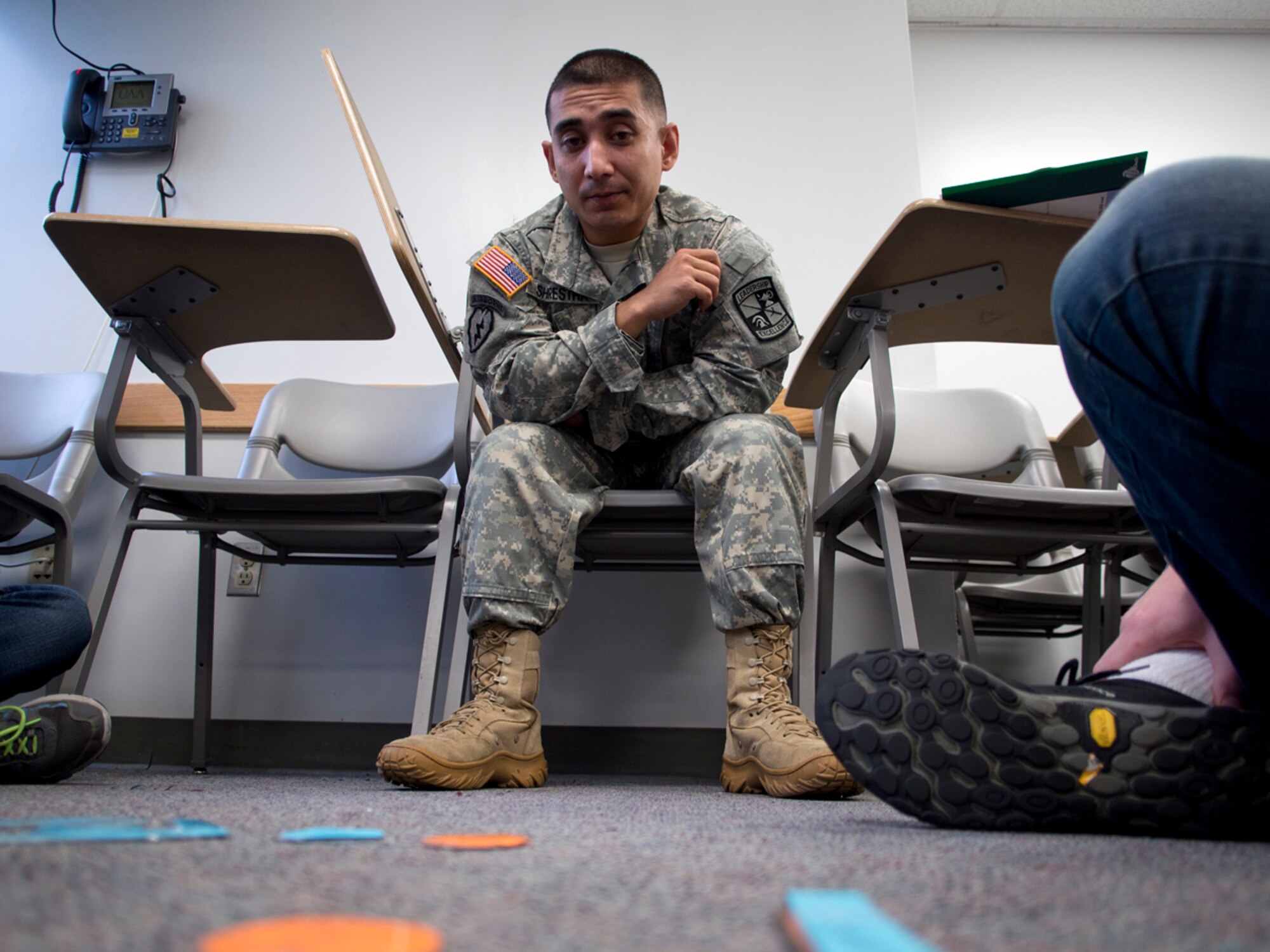 Spc. Bijesh Shrestha, an Army ROTC cadet at the University of Alaska Anchorage and native of Malangawa, Nepal, devises a concept of operations during ROTC class. Shrestha completed two years of study, making him eligible for the Green to Gold Active Duty Option Program, allowing him to earn his commission in two years. (U.S. Air Force photo/David Bedard)