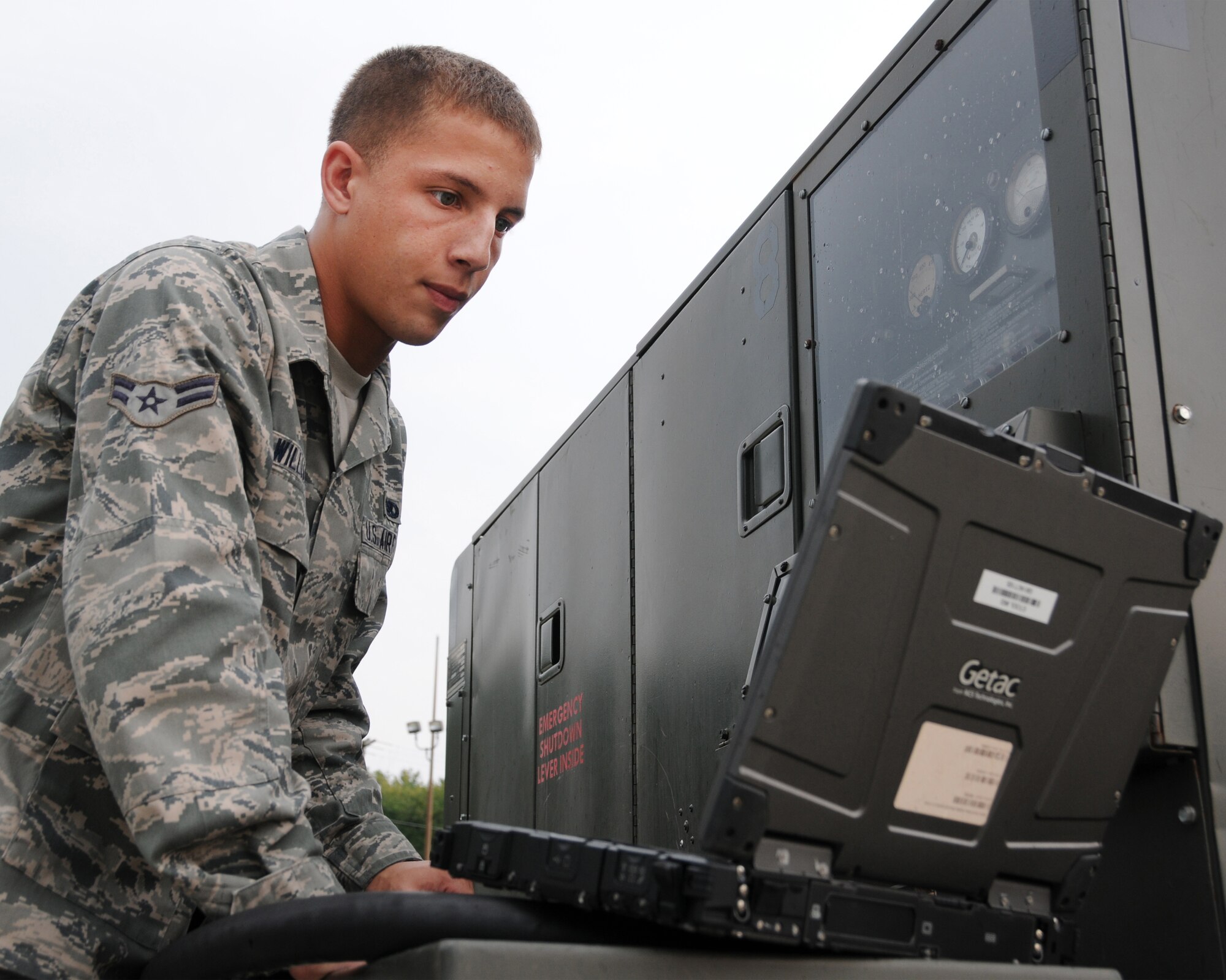Airman 1st Class Joshua Williams performs a service inspection on aircraft generation equipment, Pease Air National Guard Base, N.H., September 12 2013.  (U.S. Air National Guard photo by Staff Sgt. Curtis J. Lenz)
