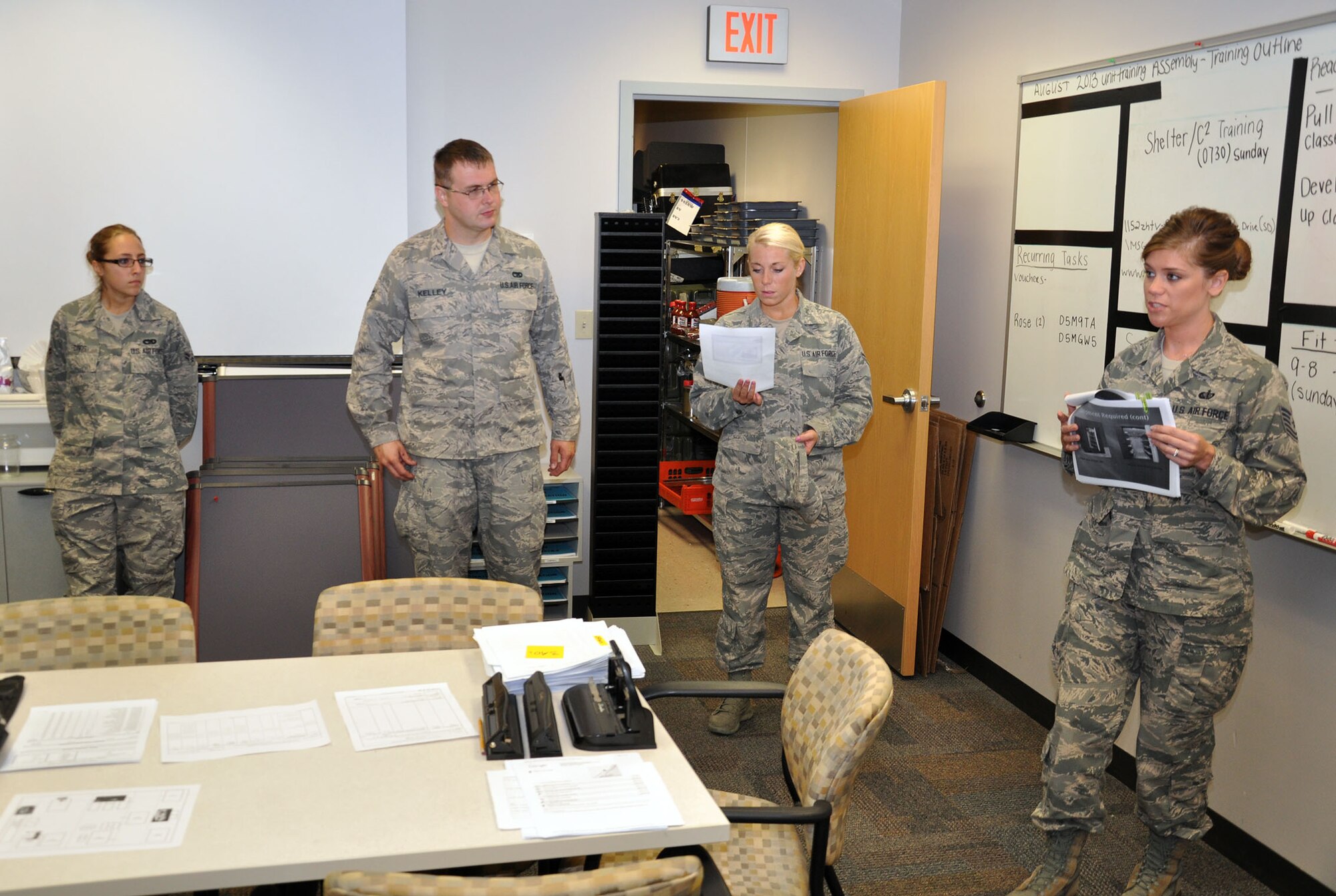 WRIGHT-PATTERSON AIR FORCE BASE, Ohio – 445th Airlift Wing job swap participants (from left to right) Airman 1st Class Therese Davis and Senior Airman John Kelley, both from the 445th Logistics Readiness Squadron, along with Airman 1st Class Photinos, 445th Operations Support Squadron, listen to Tech. Sgt. Jessica Pruitt, 445th Force Support Squadron, brief on mortuary affairs and the role it plays in the 445th Services Sustainment Flight during the Sept. 8  445th FSS job swap. (U.S. Air Force photo/Capt. Demetrius Smith) 