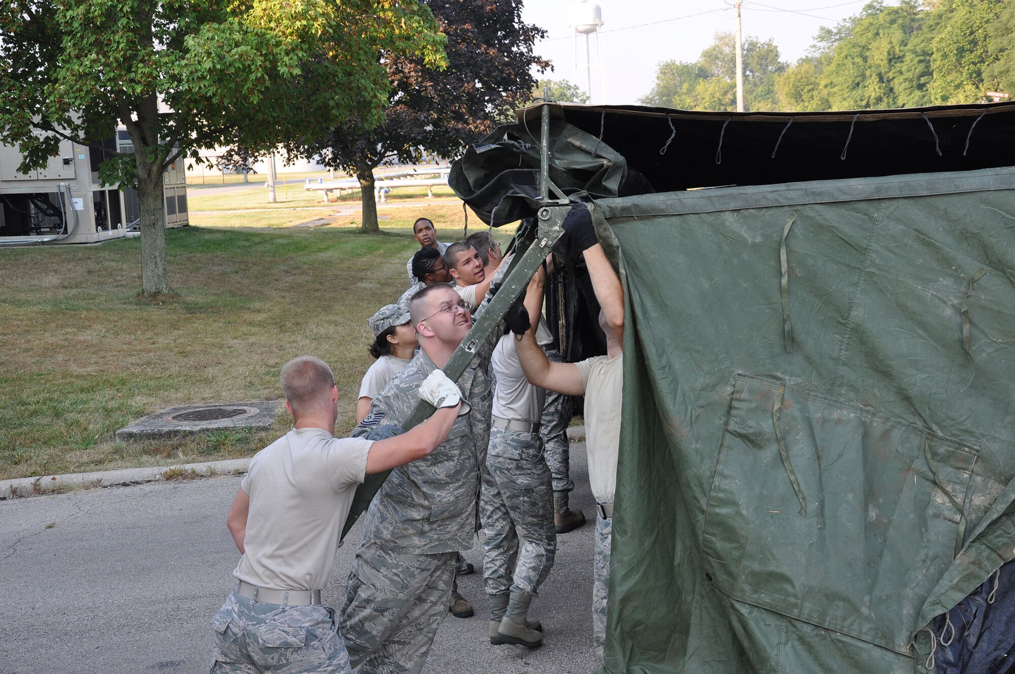 WRIGHT-PATTERSON AIR FORCE BASE, Ohio – 445th Airlift Wing job swap participants learn how to put up a field kitchen as part of their tour of the 445th Services Sustainment Flight during the Sept. 8 445th Force Support Squadron hosted job swap. (U.S. Air Force photo/Capt. Demetrius Smith)