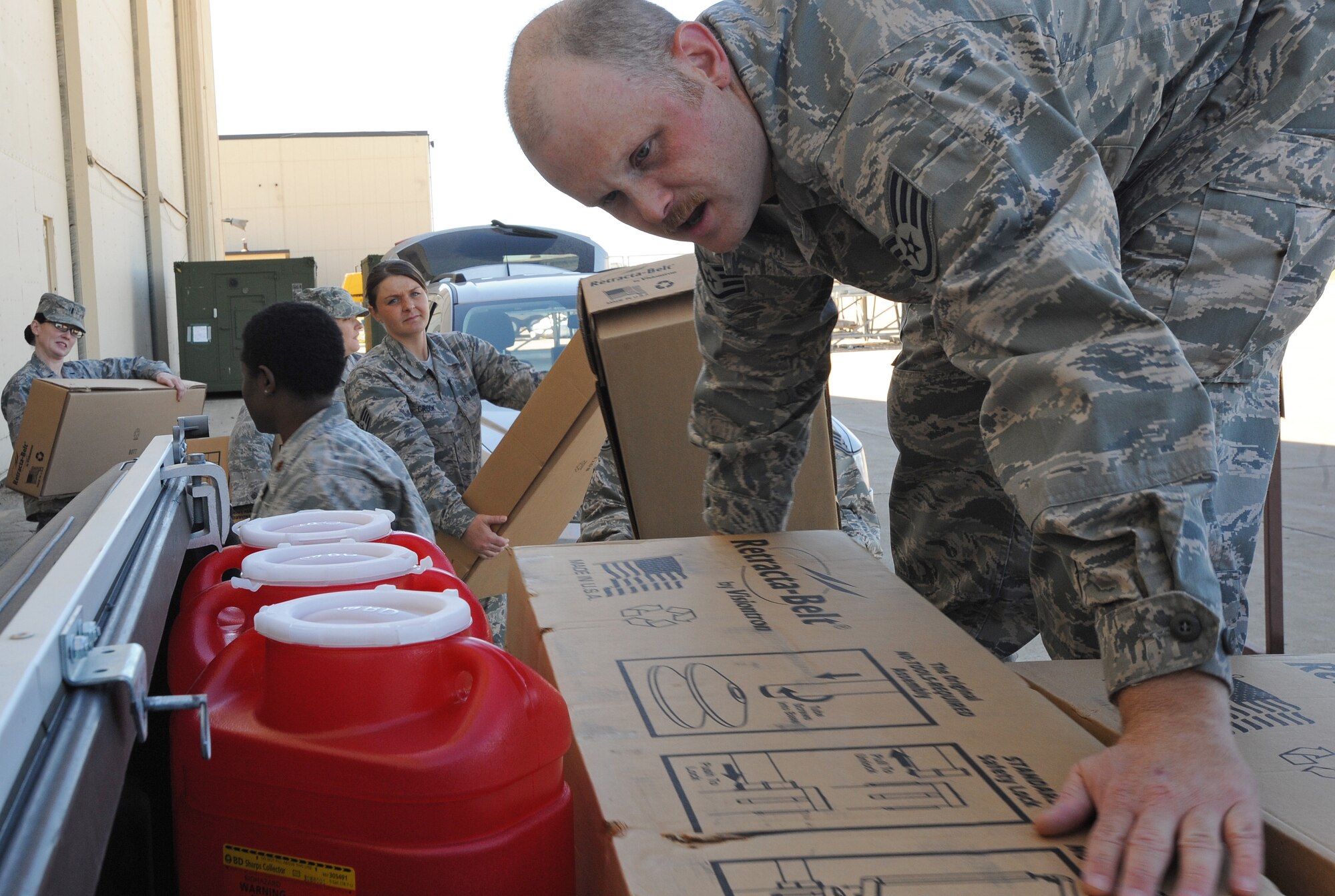 Staff Sgt. Blair Morin, 5th Medical Operations Squadron primary health element leader, loads critical supplies used in support of the 5th Medical Group's Point of Distribution exercise at Dock 9, Sept. 19-20. During this exercise, 5th MDG personnel demonstrated their ability to issue emergency medical supplies and medication to the active duty population in a timely and precise manner. (U.S. Air Force photo/Senior Airman Jose L. Hernandez)