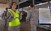 Staff Sgt. Tara Crook, 5th Medical Operations Squadron force health management noncommissioned officer in charge, ensures safe and orderly distribution of the flu mist to Airmen as part of the 5th Medical Group’s Point of Distribution exercise at Dock 9, Sept. 19-20. The POD exercise evaluated the 5th MDG's ability to distribute emergency medical supplies to the active duty population. The 5th MDG in conjunction with the 5th Logistics Readiness Squadron and 5th Security Force Squadron was able to precisely load, transport, vaccinate and return more than 2,000 Airmen during the POD exercise in an average time of 17 minutes per person. (U.S. Air Force photo/Senior Airman Jose L. Hernandez)