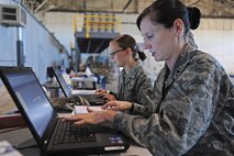 1st Lt. Louisa Clift, 5th Medical Support Squadron Medical Information Services Flight commander, verifies proper documentation of the flu mist administered to Airmen during a Point of Distribution exercise conducted by the 5th Medical Group at Dock 9, Sept. 19-20. The 5th MDG coupled real world medical requirements with a training exercise to vaccinate more than 2,000 Airmen in 21 hours. (U.S. Air Force photo/Senior Airman Jose L. Hernandez)