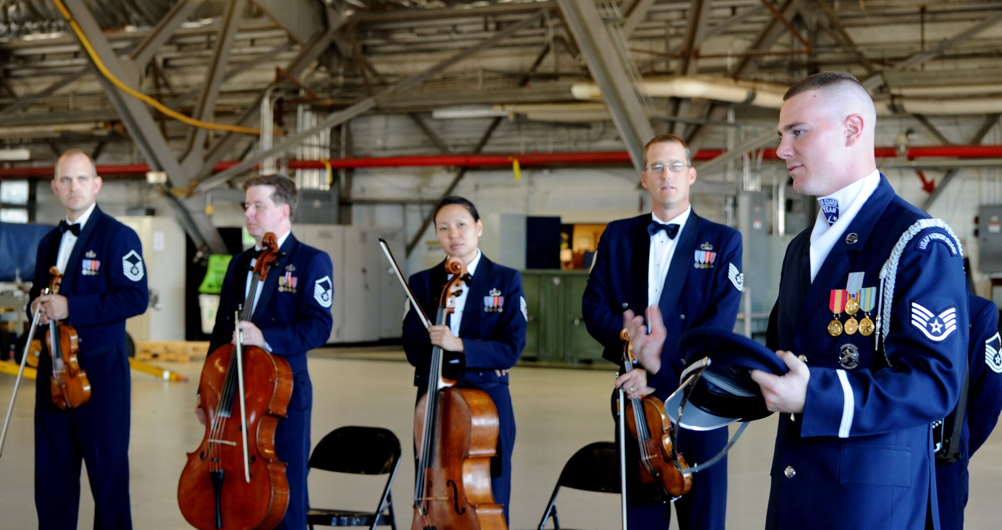 Staff Sgt. Andrew Winders  explains the training U.S. Air Force Honor Guard Drill Team members go through before they preform to Maryland Delegate Melony Griffith from District 25 during an orientation tour of Joint Base Andrews, Md., Sept. 25, 2013. The Drill Team promotes the Air Force mission by showcasing drill performances at public and military venues to recruit, retain, and inspire Airmen. (U.S. Air Force photo/ Tech. Sgt. Tammie Moore)