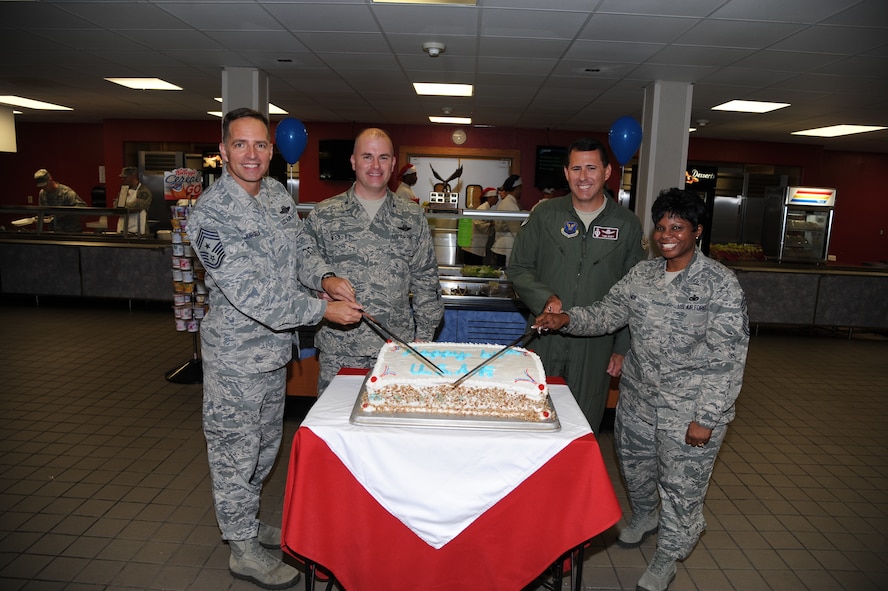 Leadership from the 5th Bomb Wing and 91st Missile Wing celebrate the United States Air Force’s anniversary by cutting a commemoration cake at the Minot Air Force Base Dining Facility, Sept. 19, 2013. The Department of the Air Force was recognized 66 years ago as an official branch of the military. (U.S. Air Force photo/Airman 1st Class Andrew Crawford)
