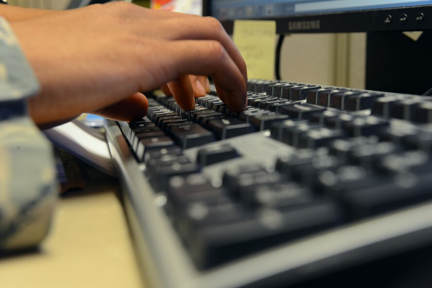 Airman 1st Class Justin Carroll, 2nd Contracting Squadron contracting specialist, creates a contract on Barksdale Air Force Base, La., Sept. 20, 2013. Carroll, along with other Airmen from the 2nd CONS, stayed after normal duty hours to complete contracts for the end of fiscal year soft closeout. Each year the Air Force receives funding for defense related expenditures that must be allocated by Sept. 30. (U.S. Air Force photo\Senior Airman Micaiah Anthony) 
