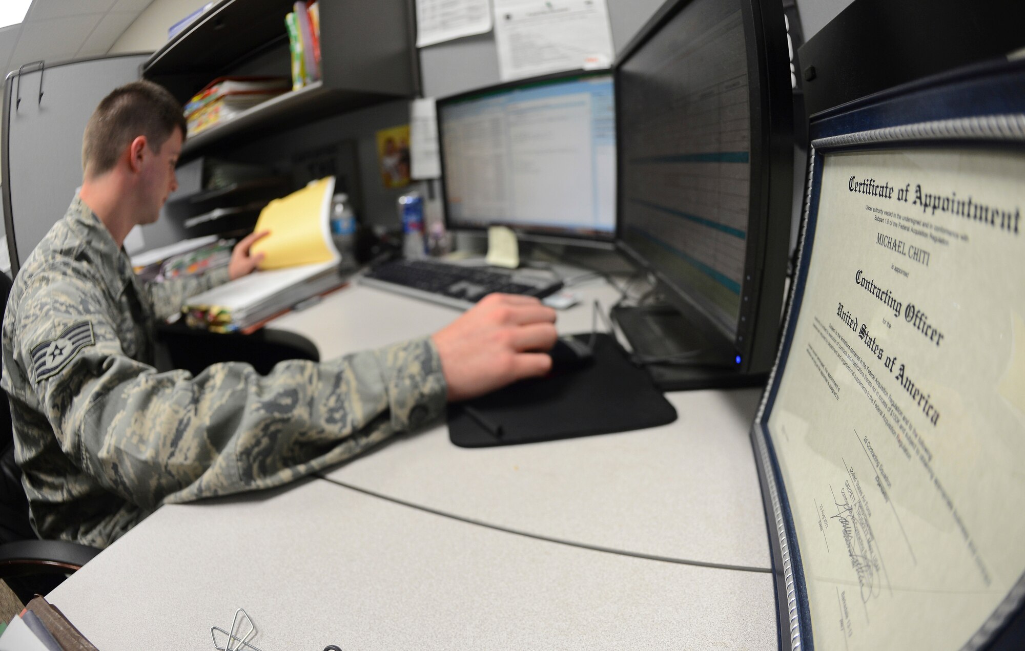 Staff Sgt. Michael Chiti, 2nd Contracting Squadron contracting officer, reviews a contract on Barksdale Air Force Base, La., Sept. 20, 2013. Contracting officers are the only individuals authorized to obligate government funds. (U.S. Air Force photo\Senior Airman Micaiah Anthony)