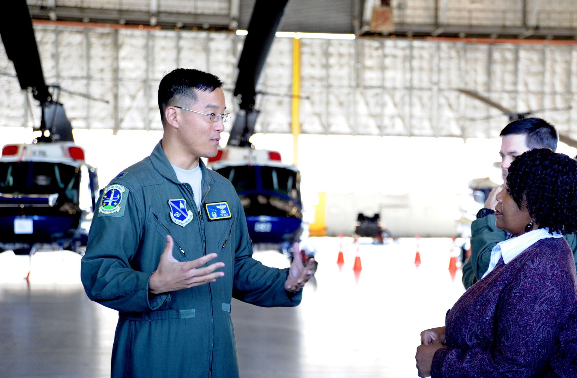 Lt. Col. Tim Buck discusses the mission of the 1st Helicopter Squadron to Maryland Delegate Melony Griffith from District 25 during an orientation tour of Joint Base Andrews, Md., Sept. 25, 2013. Buck is the 1st HS commander. Airmen assigned to the 1st HS provide airlift support for the Executive Branch, high-ranking dignitaries, high-ranking military leaders and other VIPs. (U.S. Air Force photo/ Tech. Sgt. Tammie Moore)