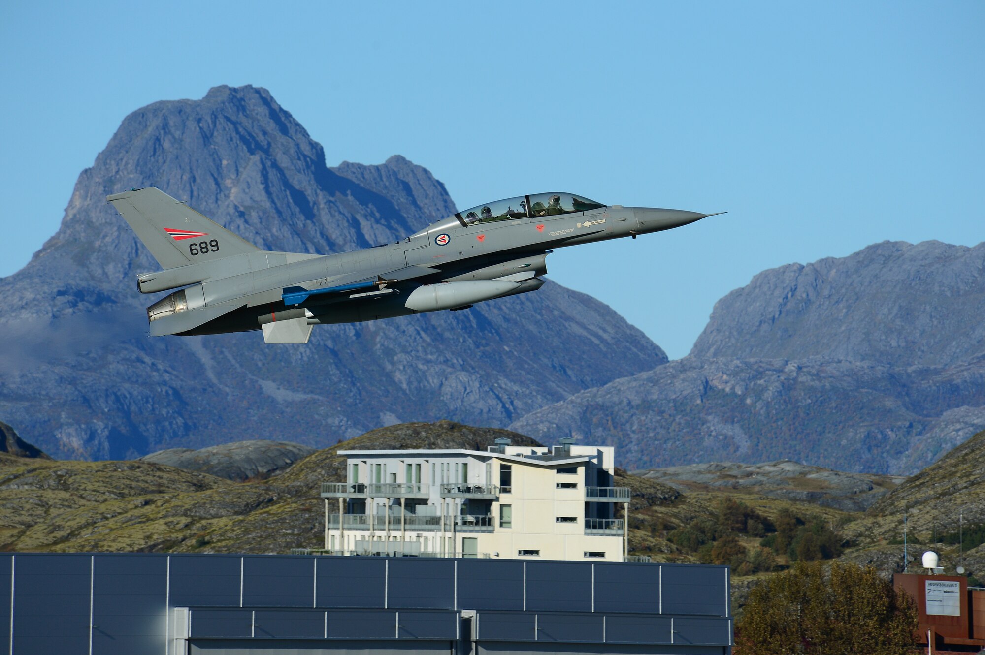A Royal Norwegian Air Force F-16 Falcon flies above Bodø Main Air Station, Norway, Sept. 24, 2013. Norway is the host nation for the Arctic Challenge Exercise 2013, it’s a combined exercise with NATO allies and regional partners designed to build upon international relationships. (U.S. Air Force photo by Master Sgt. Lee Osberry/Released)
