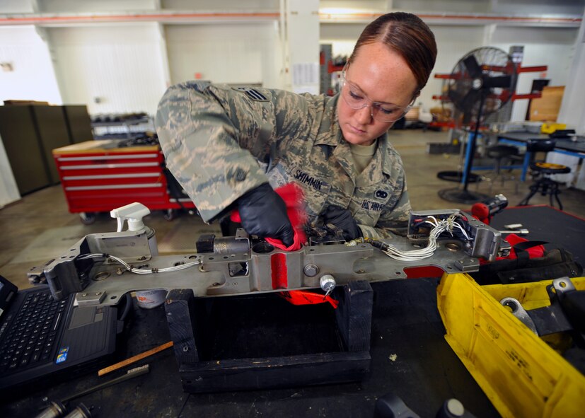 Senior Airman Kelsey Shimmin, 51st Munitions Squadron aircraft armament systems and weapons technician, cleans part of an F-16 Fighting Falcon at Osan Air Base, Republic of Korea, Sept. 25, 2013. Shimmin specializes in inspecting, maintaining, and repairing parts of the F-16’s weapons system. (U.S. Air Force photo/Senior Airman Siuta B. Ika)