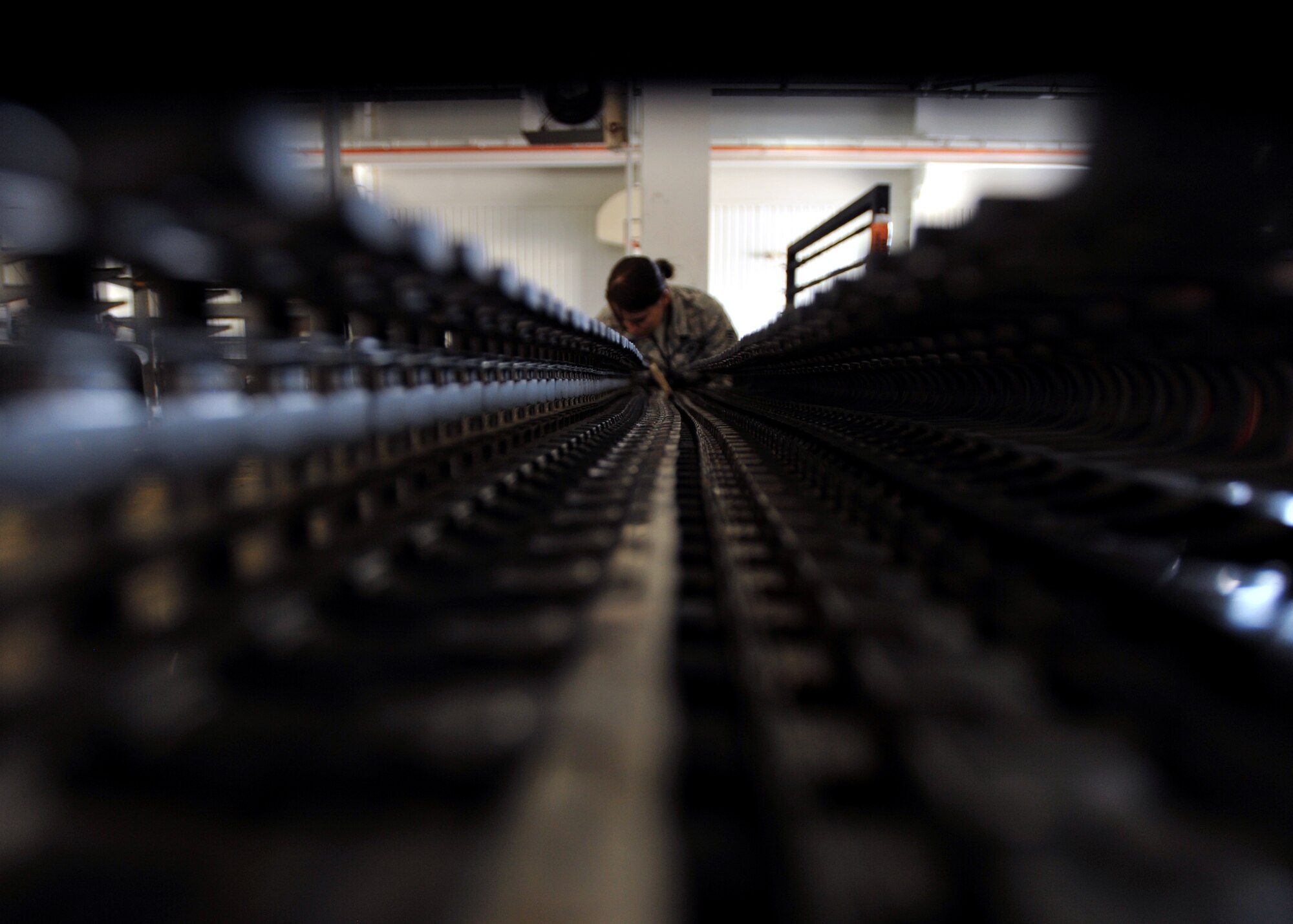 Senior Airman Arendina Van Hulten, 51st Munitions Squadron weapons loader, repairs an A-10 Thunderbolt’s ammunition feeder at Osan Air Base, Republic of Korea, Sept. 25, 2013. In addition to the 30-mm gun, the A-10’s armament includes up to 16,000 pounds of mixed ordnance on eight under-wing and three under-fuselage pylon stations. (U.S. Air Force photo/Senior Airman Siuta B. Ika)