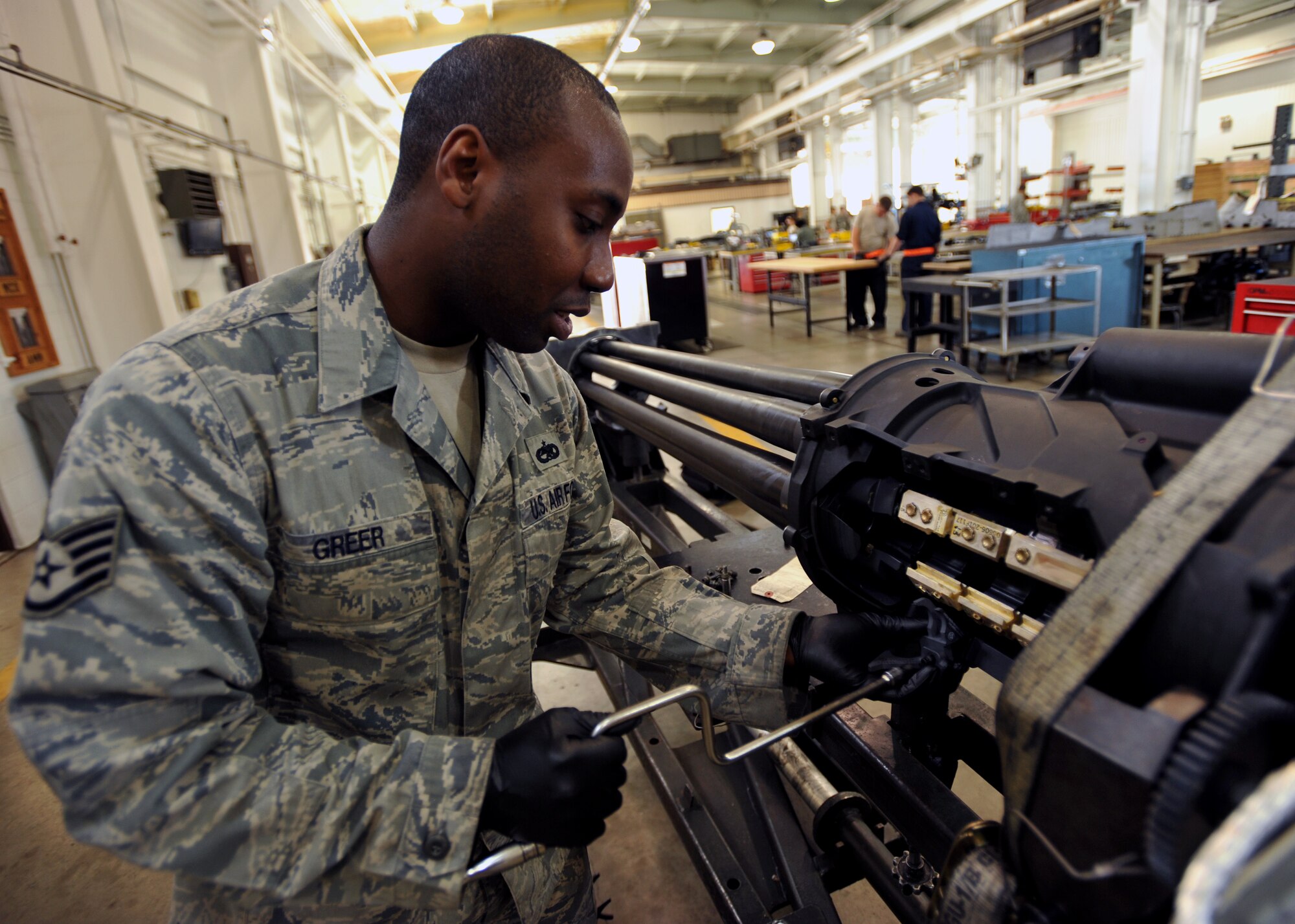 Staff Sgt. Michael Greer, 51st Munitions Squadron aircraft armament systems and weapons technician, services an A-10 Thunderbolt’s 30-mm gun at Osan Air Base, Republic of Korea, Sept. 25, 2013. The A-10’s gun is capable of firing 3,900 rounds per minute to defeat a wide variety of targets, including tanks. (U.S. Air Force photo/Senior Airman Siuta B. Ika)