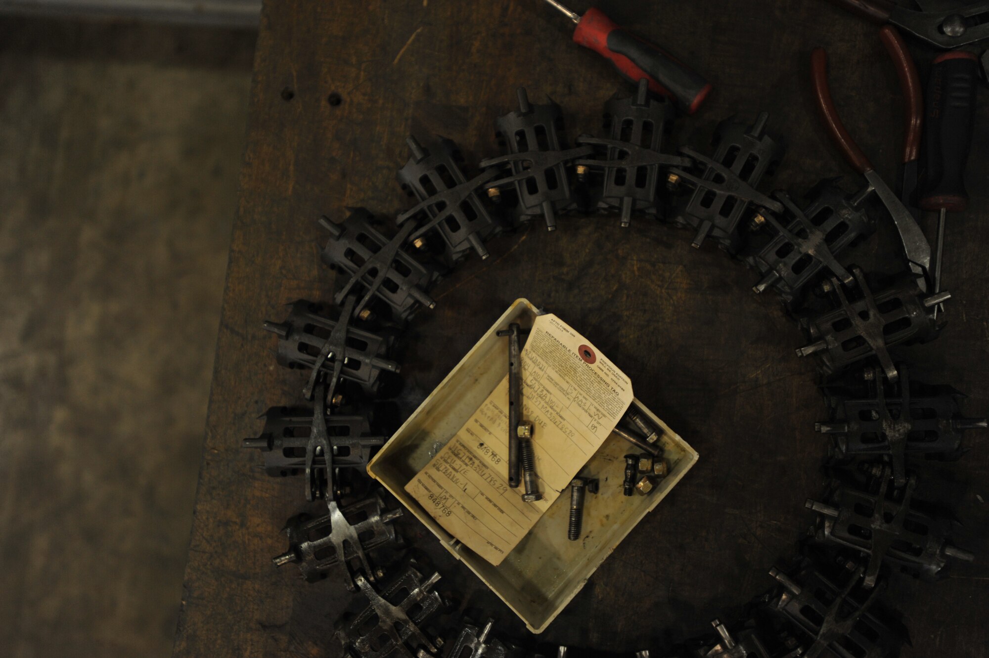 An element from an A-10 Thunderbolt’s ammunition feeder awaits maintenance at Osan Air Base, Republic of Korea, Sept. 25, 2013. Technicians in the weapons back shop perform scheduled and unscheduled maintenance tasks to A-10 and F-16 Fighting Falcon weapons systems in proper working order. (U.S. Air Force photo/Senior Airman Siuta B. Ika)