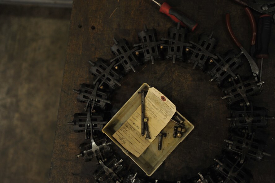 An element from an A-10 Thunderbolt’s ammunition feeder awaits maintenance at Osan Air Base, Republic of Korea, Sept. 25, 2013. Technicians in the weapons back shop perform scheduled and unscheduled maintenance tasks to A-10 and F-16 Fighting Falcon weapons systems in proper working order. (U.S. Air Force photo/Senior Airman Siuta B. Ika)