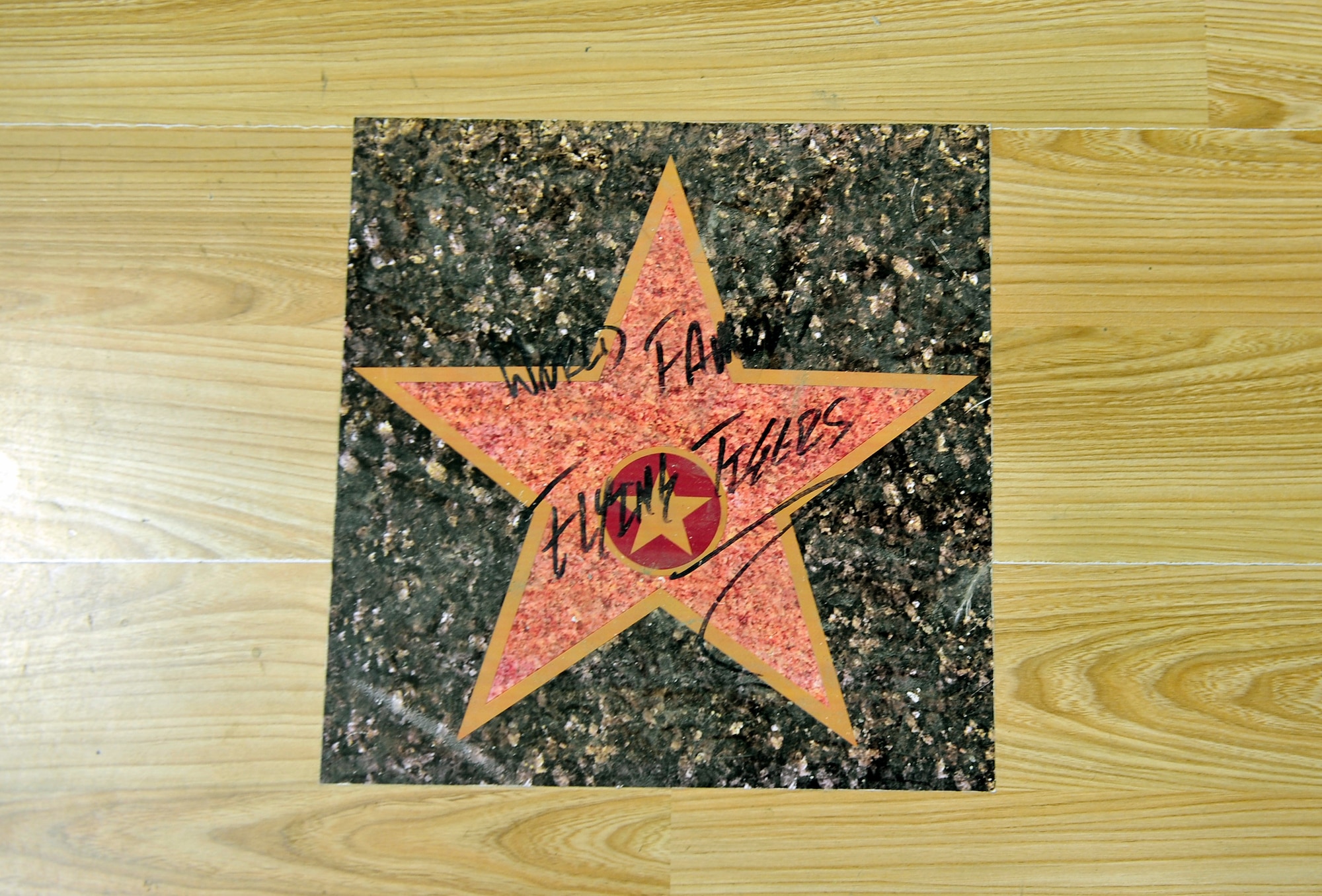 The 74th Expeditionary Fighter Squadron places stars on the floor of their building on Bagram Airfield, Afghanistan. The stars are signed by A-10 pilots prior to redeploying.(U.S. Air Force photo/ Staff Sgt. Stephenie Wade)