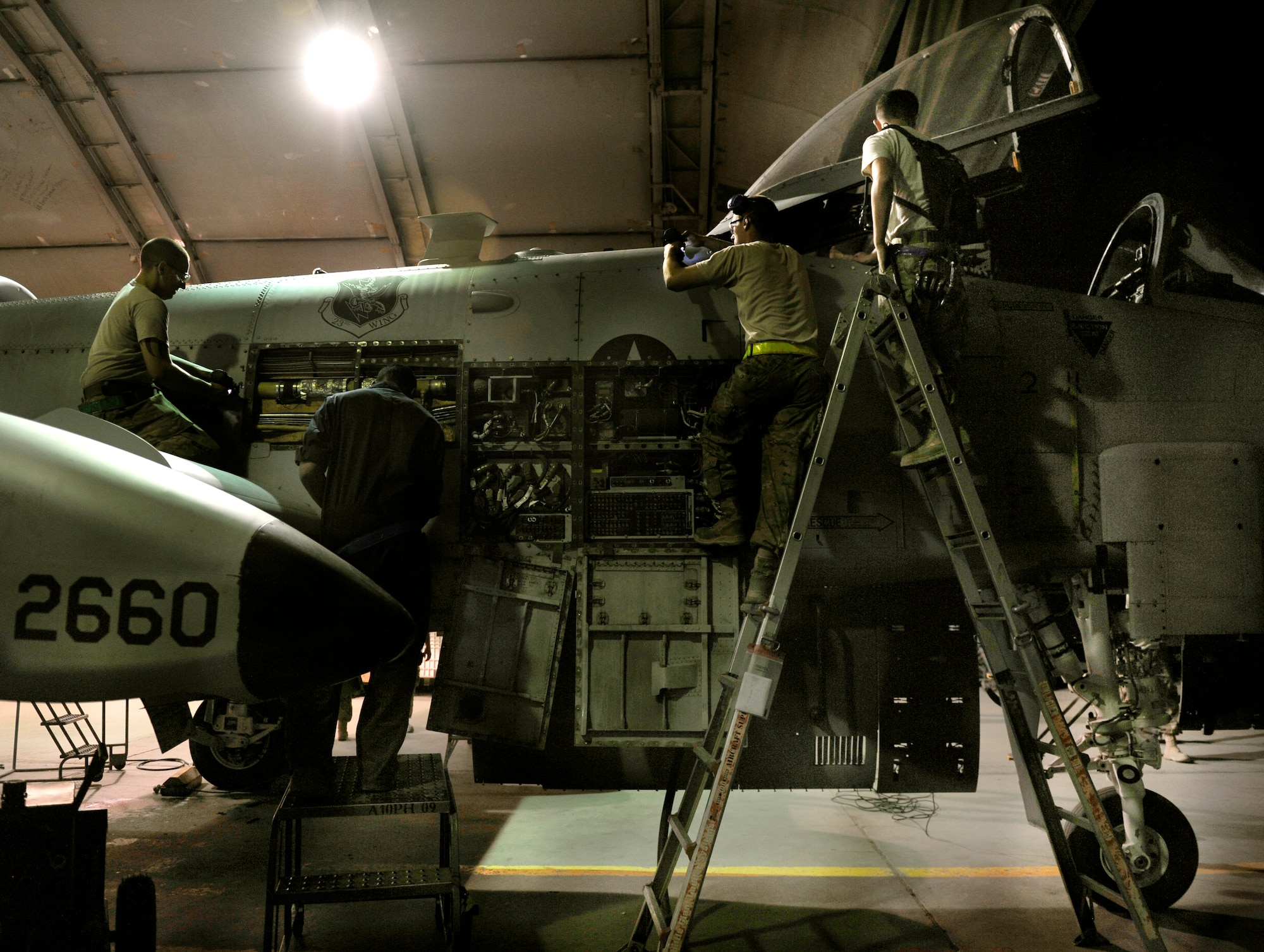 Crew chiefs assigned to the 455th Expeditionary Aircraft Maintenance Squadron  conduct maintenance on an A-10 Thunderbolt II aircraft during a phase inspection on Bagram Airfield, Afghanistan. The 455th EAMXS Airmen conducted 33 A-10 phase inspections during their six month deployment here. The A-10's and maintainers are deployed from Moody Air Force Base, Ga. (U.S. Air Force photo/ Staff Sgt. Stephenie Wade)