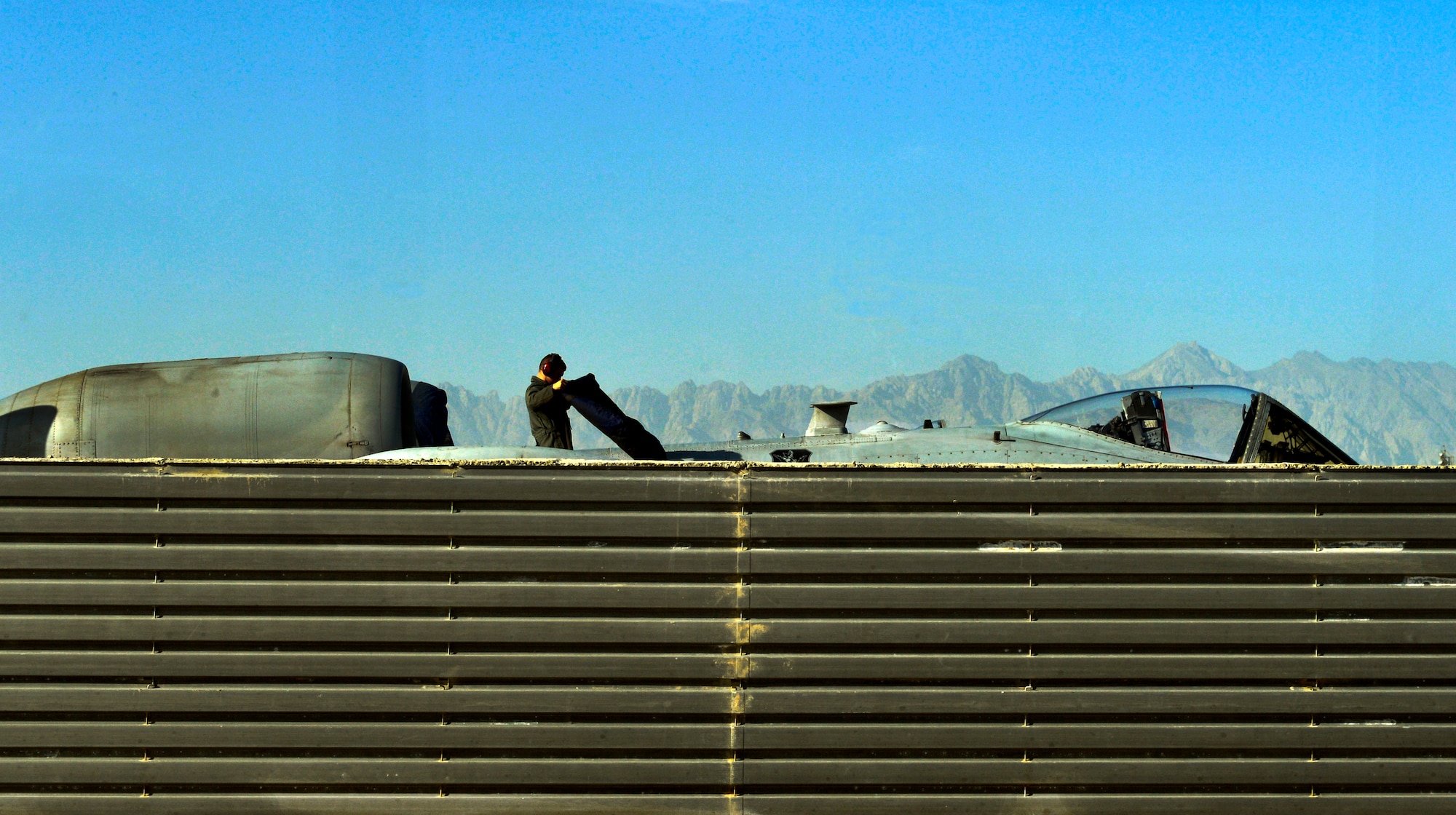An Airman assigned to the 455th Expeditionary Aircraft Maintenance Squadron crew chief, cleans an A-10 Thunderbolt II on Bagram Airfield, Afghanistan. (U.S. Air Force photo/ Staff Sgt. Stephenie Wade)