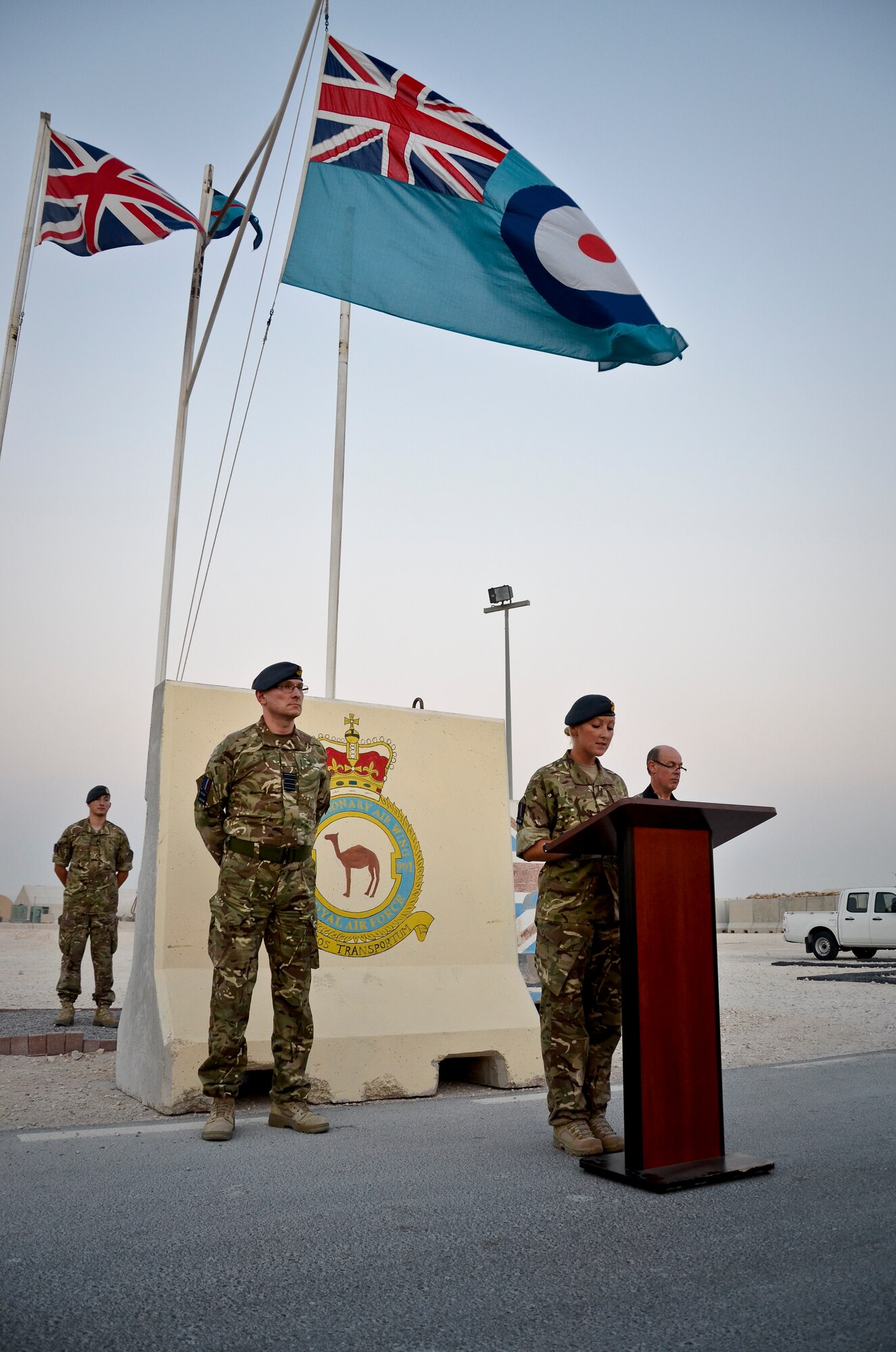 Flight Lt. Claire Wells addresses those in attendance during the Battle of Britain Day parade ceremony at the 379th Air Expeditionary Wing in Southwest Asia, Sept. 20, 2013. Winston Churchill summed up the effect of the battle and the contribution of Fighter Command with the words, “Never in the field of human conflict was so much owed by so many to so few.” Pilots who fought in the battle have been known as ‘The Few’ ever since. Wells is an 83 Expeditionary Air Group detachment administration officer. (U.S. Air Force photo/Staff Sgt. Benjamin W. Stratton)