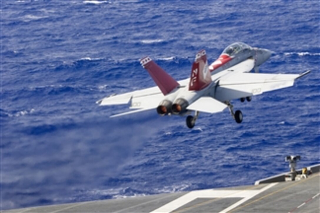 A U.S. Navy F/A-18F Super Hornet launches from the flight deck of the aircraft carrier USS George Washington (CVN 73) as the ship conducts flight operations in the Pacific Ocean on Sept. 25, 2013.  The George Washington and its embarked Carrier Air Wing 5 are deployed to conduct maritime security operations and theater security cooperation efforts in the Pacific.  The Super Hornet is attached to Strike Fighter Squadron 102.  