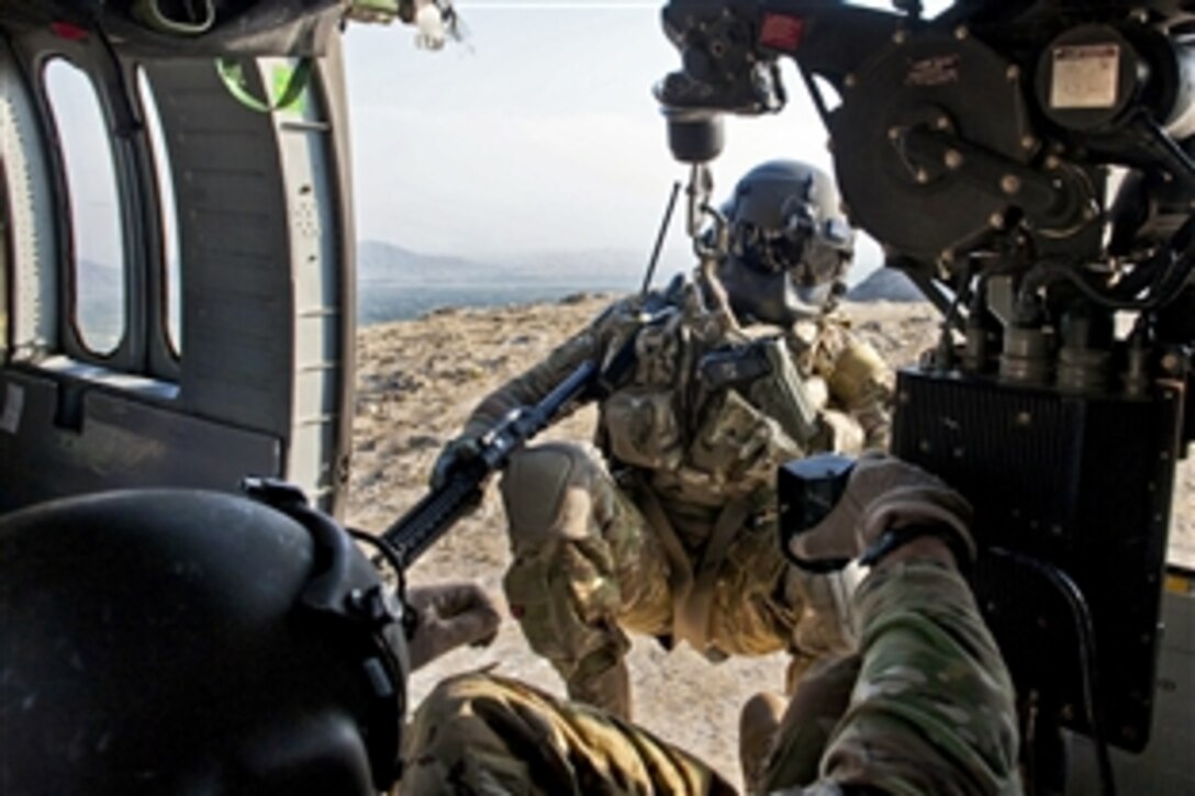 A UH-60 Black Hawk helicopter hoists U.S. Army Sgt. Brandon Coburn back into the aircraft during training near Forward Operating Base Fenty in Afghanistan's Nangarhar province, Sept. 16, 2013. Coburn, a medic, is assigned to Company C, 3rd Battalion, 238th Aviation Regiment, Medevac Platoon "Dustoff." 