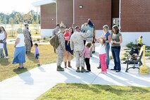 Marines with 2nd Explosive Ordnance Disposal Company, 8th Engineer Support Battalion, 2nd Marine Logistics Group spend time with their families and friends at the EOD Headquarters building before deploying to Afghanistan aboard Camp Lejeune, N.C., Sept. 26, 2013. EOD technicians perform various hazardous duties that include locating, identifying, neutralizing and disposing of hazards that present a threat to operations, installations, personnel, or materiel. 