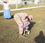 Staff Sgt. Ian P. Hassing, an Explosive Ordnance Disposal technician with 2nd EOD Company, 8th Engineer Support Battalion, 2nd Marine Logistics Group, plays with his daughter at the 2nd EOD headquarters building aboard Camp Lejeune, N.C., Sept. 26, 2013. Marines with the company spent a few hours with their family, friends and fellow service members before saying their goodbyes. 