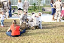Marines with 2nd Explosive Ordnance Disposal Company, 8th Engineer Support Battalion, 2nd Marine Logistics Group spend time with their families and friends at the EOD Headquarters building before deploying to Afghanistan aboard Camp Lejeune, N.C., Sept. 26, 2013. Family, friends and fellow comrades came to visit the service members before departing overseas.