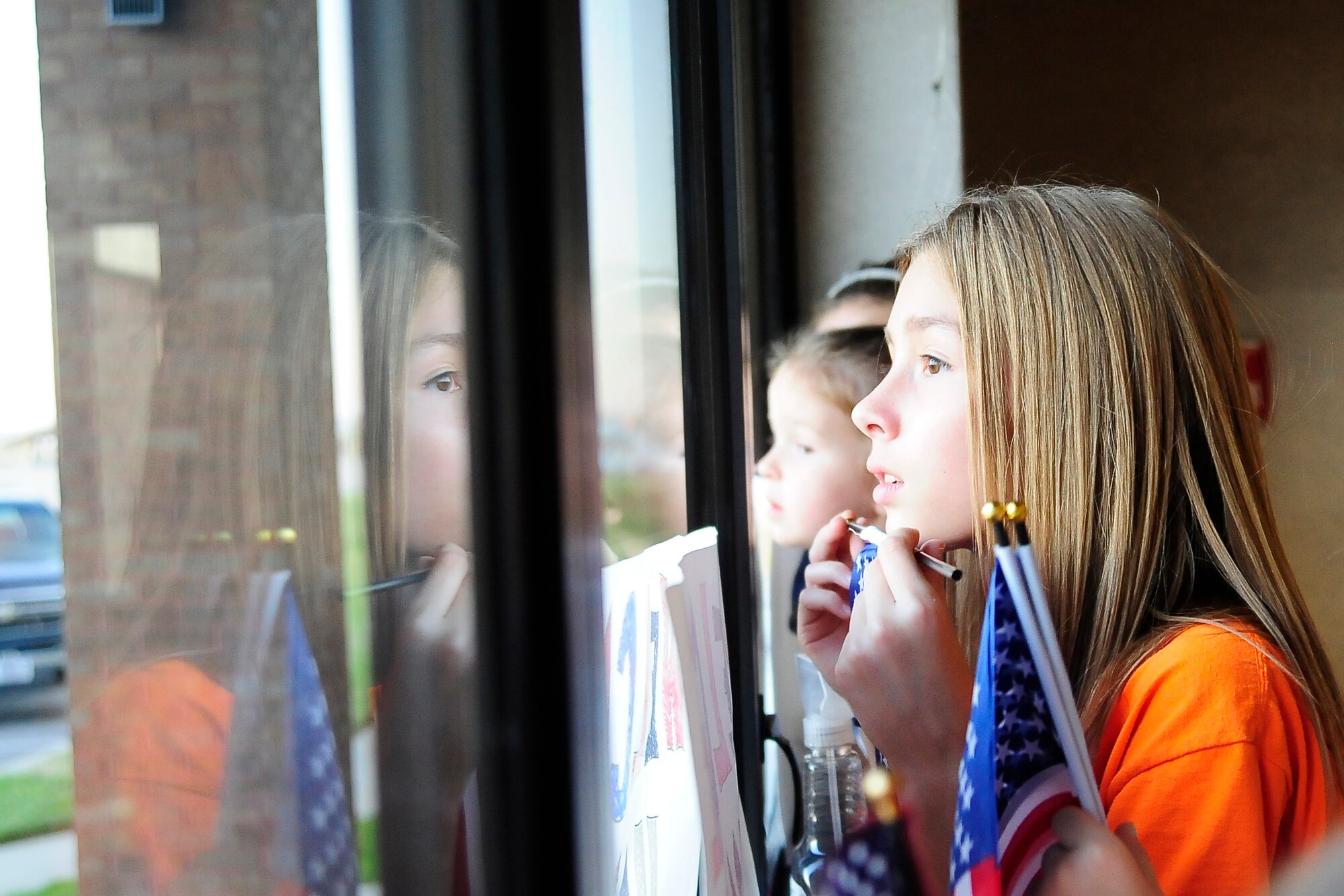 The daughter of an Airman from the 442nd Security Forces Squadron anticipates her father’s return to Whiteman Air Force Base, Mo., Sept. 27, 2013. Nearly 30 Airmen from the squadron deployed to Manas Air Base, Kyrgyzstan, as part of the 376th Expeditionary Security Forces Squadron and spent six months providing base defense.  (U.S. Air Force photo by Staff Sgt. Brigitte N. Brantley/Released)