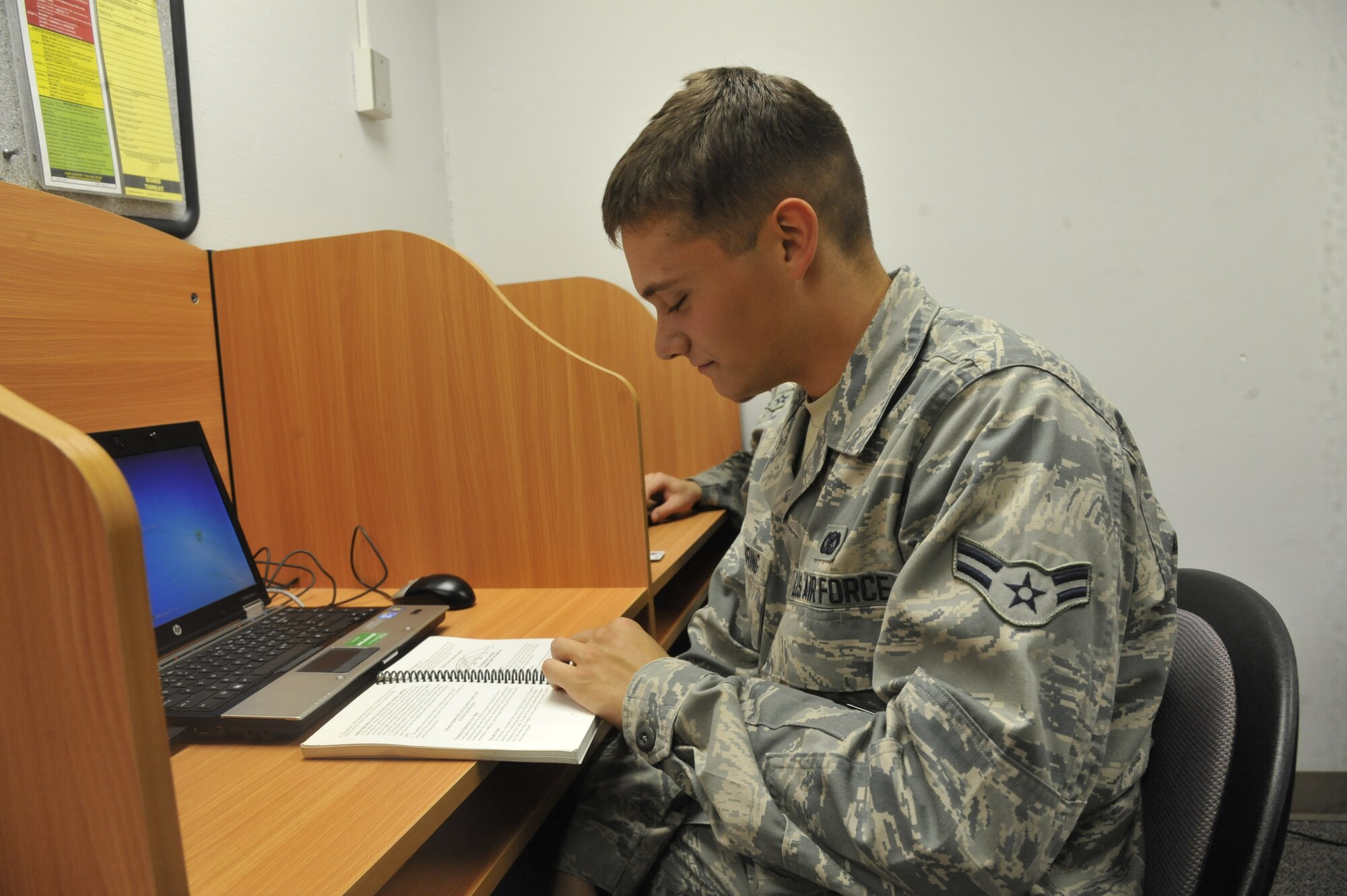 U.S. Air Force Airman 1st Class Austin Goebring, 442ndh Security Forces Squadron response force member, studies security forces manual at Whiteman Air Force Base, Mo., Sept. 19, 2013. As a reservist, Goebring works with the 509th Security Forces Squadron to complete his Career Development Courses to advance further in his careers. (U.S. Air Force photo by Airman 1st Class Keenan Berry/Released)